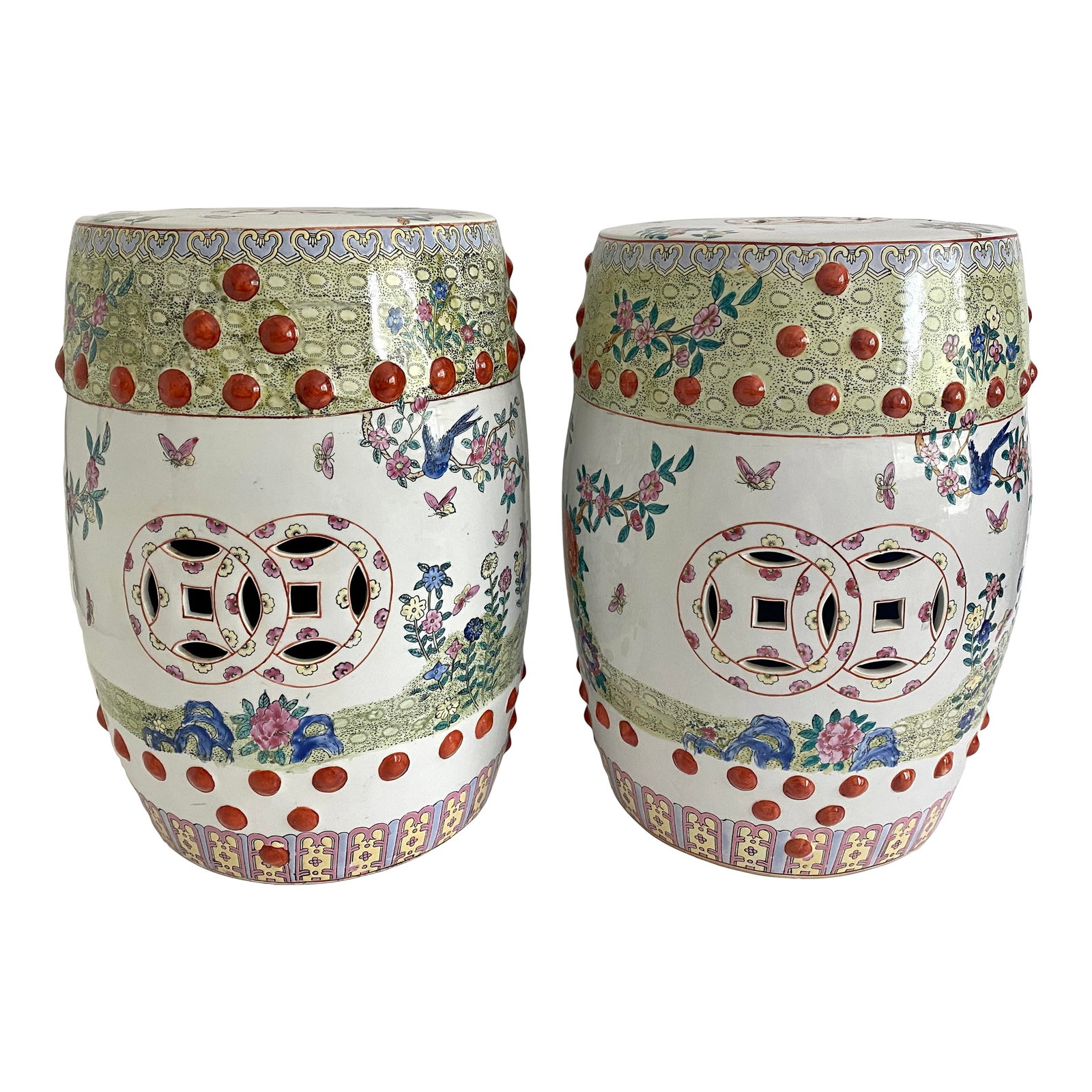 Chinese Famille Rose Garden Seat Circa 1900 - A Pair: A pair of Famille Rose traditional Chinese hand-painted porcelain garden stools featuring flowers, butterflies, and birds with detailed intricate borders and trim. And of course the pierced double