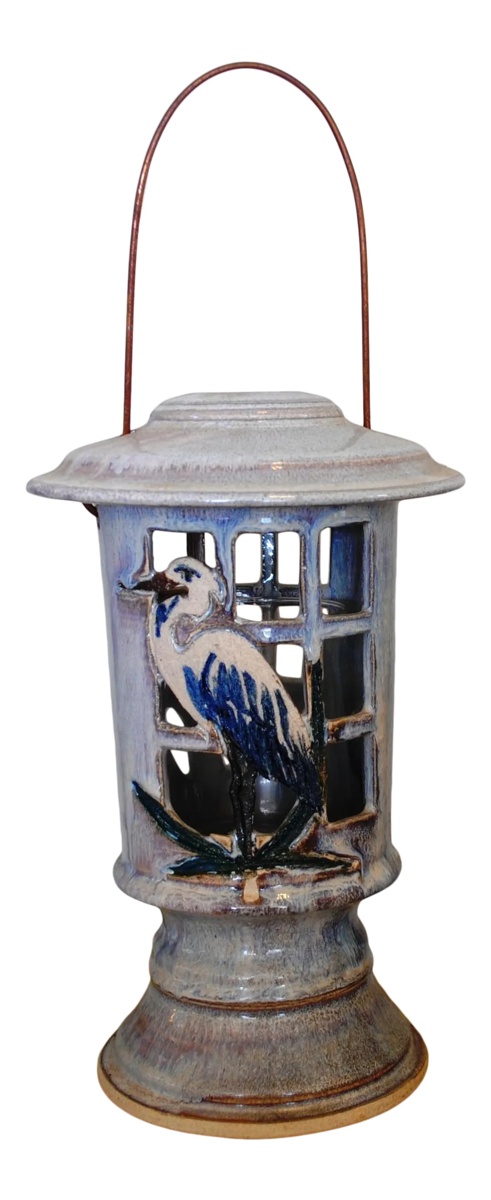 Late 20th Century Ceramic Heron Design Candle Lantern Signed: Beautiful Handmade ceramic pottery candle lantern.Signed on the bottom by the artist.The cut out design is a heron on the front and a lily on the back.There is a clear glass sleeve inside the lantern