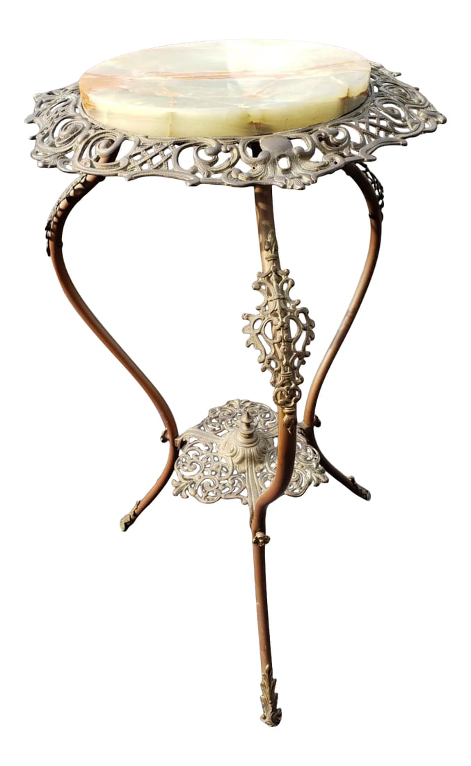 1970s Carved Iron With Stone Top Plant Stand: Meticulously carved iron with natural stone top lamp table or plant stand for indoor or outdoor use. Removable stone top. that appears to have been repaired. Condition: Alterations: Original Condition