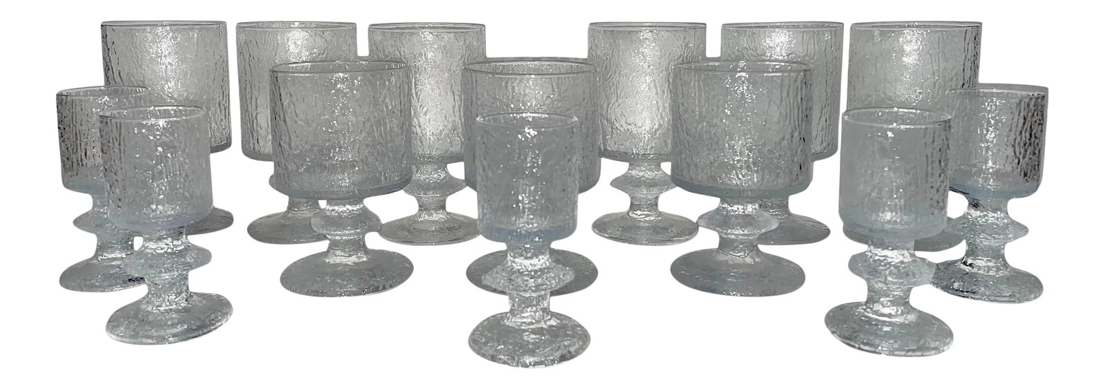 1960s Timo Sarpaneva Wine Glasses, 14 Pieces: Timo Sarpaneva designed "Senator" stemware glasses. Clear textured glass has the visual texture of carved ice. Made in Finland in the 1960's by Iittla. 14 piece set includes 6 - 12 ounce glasses, 3 - 