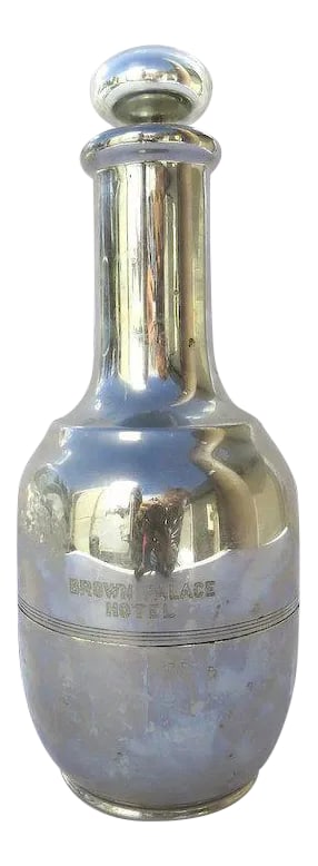 Vintage Cocktail Carafe Pitcher with Mercury Glass Stopper from the Historic Brown Palace Hotel Denv: Vintage cocktail carafe pitcher from the historic Brown Palace Hotel in Denver, CO. Mercury glass stopper and lovely chrome finish. Engraved on front with "Brown Palace Hotel." c. early 1900's