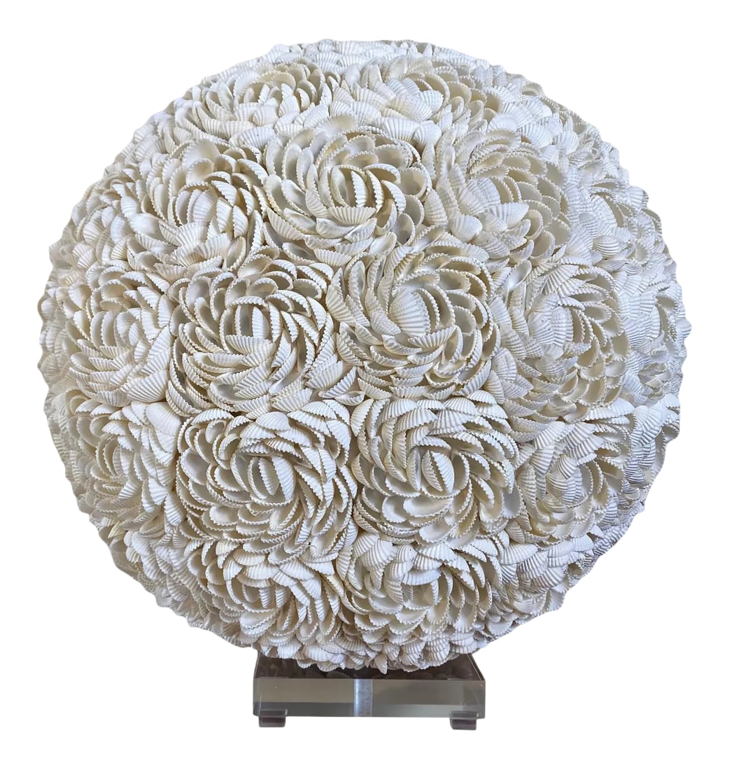 Shell Covered Orb Light Fixture on Lucite Base: Designed and assembled by Junk is the new black. Thousands of shells make up this 18" orb. Its beautiful on its own, but even more gorgeous sitting on this clear lucite base, with light coming