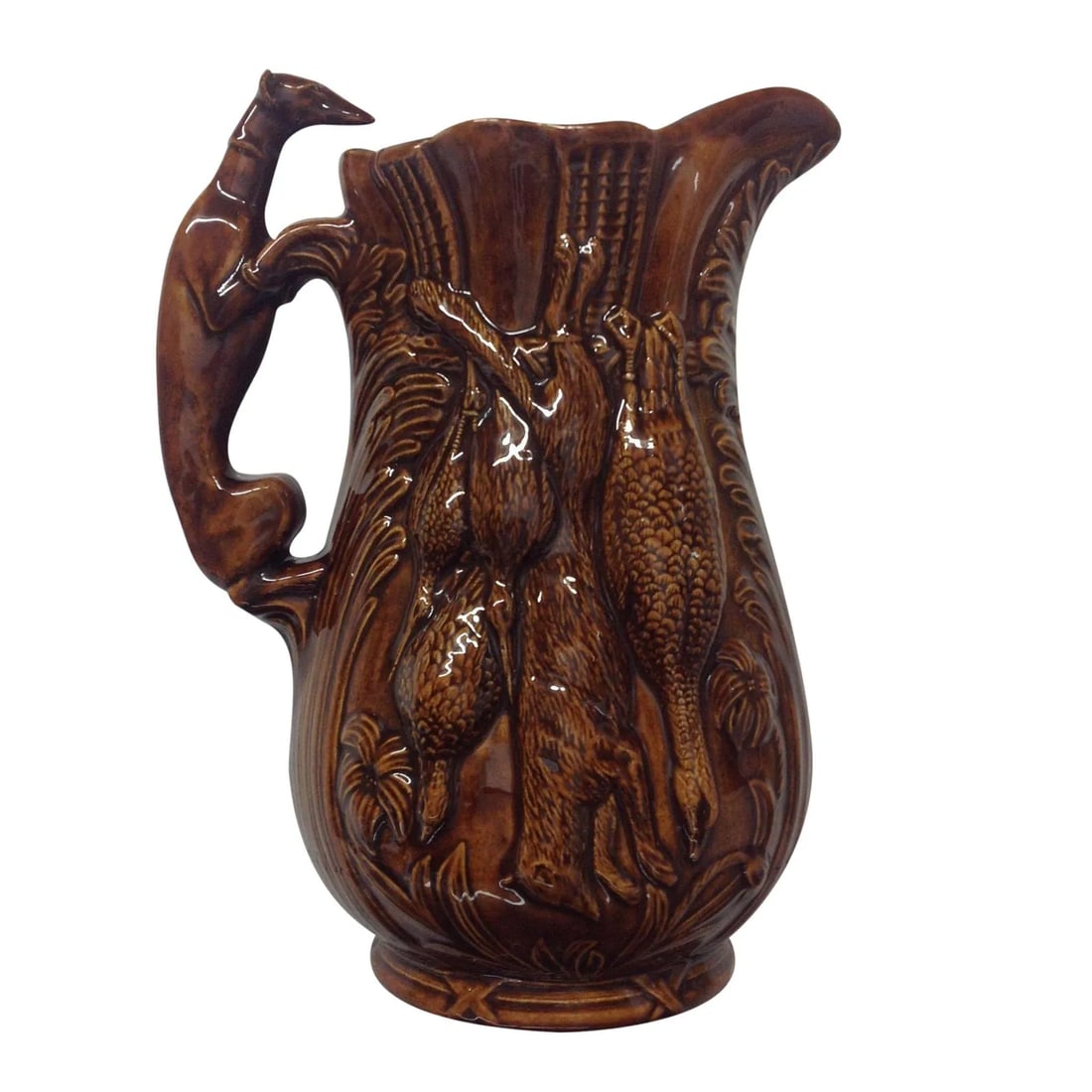 Rockingham Tobacco Glaze Game Pitcher: 1850s Rockingham N.J. tobacco glaze game pitcher. A super piece of Americana in a highly sought after rare form. We ALWAYS accept reasonable offers. Before it's gone forever...make an offer!