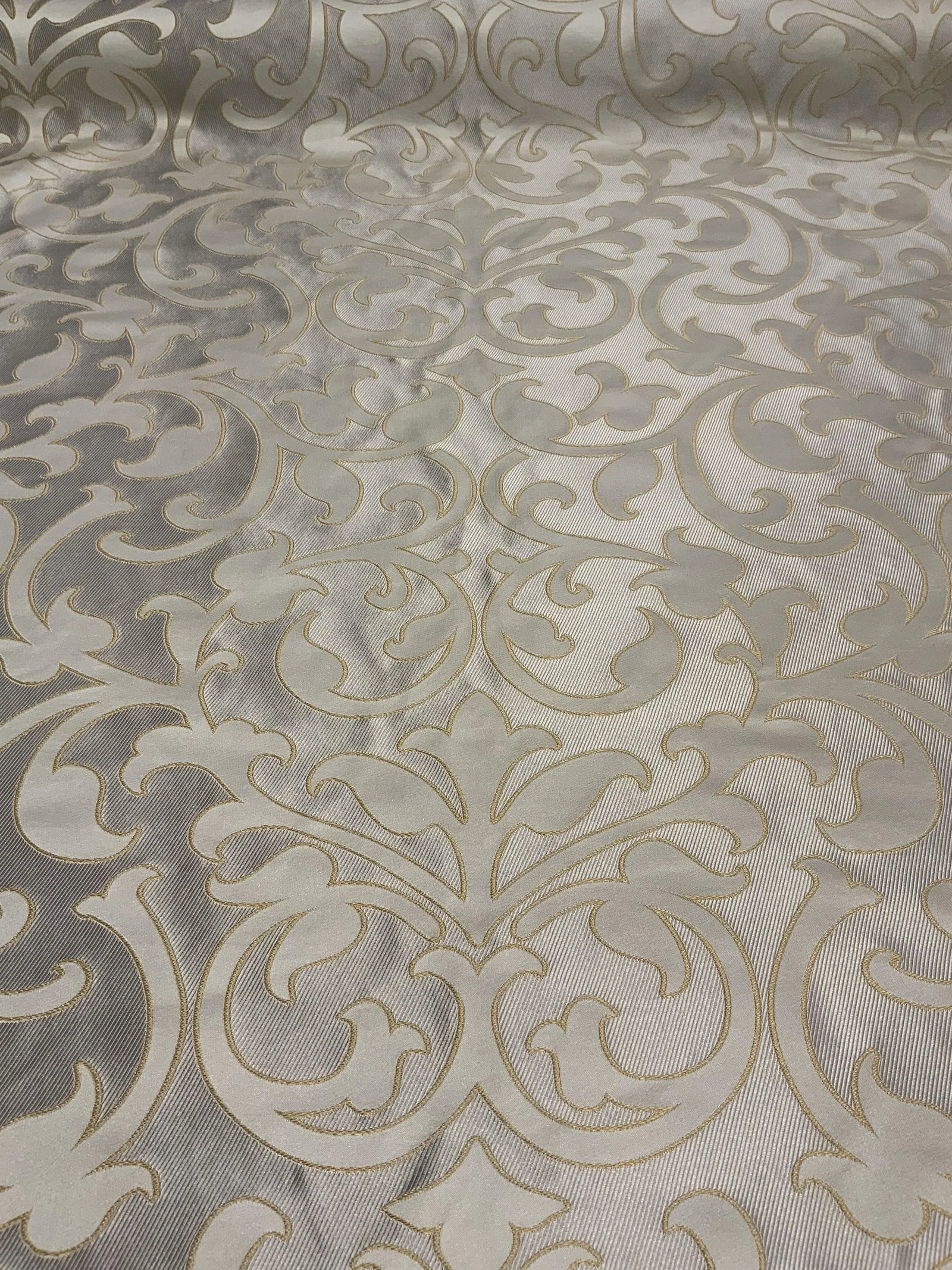 Caracole Traditional Gold, Silver, and Ivory Applique Designer Fabric - 9 Yards: This fabric has a timeless colorway and can be used in a multitude of design schemes. The hand is medium and the silver base has a stripe pattern.. This fabric can be used for upholstery, pillows and