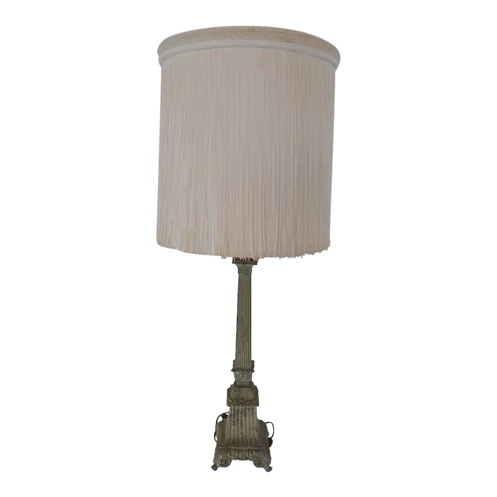 Vintage 1950s French Cast Iron Lamp: This beauty French cast iron lamp is from the 50s. The extra large lamp shade has a fine coat of tassels fabric over and it on a ivory color. 35" tall, 6" wide base, 24" tall with out hardware. Lamp