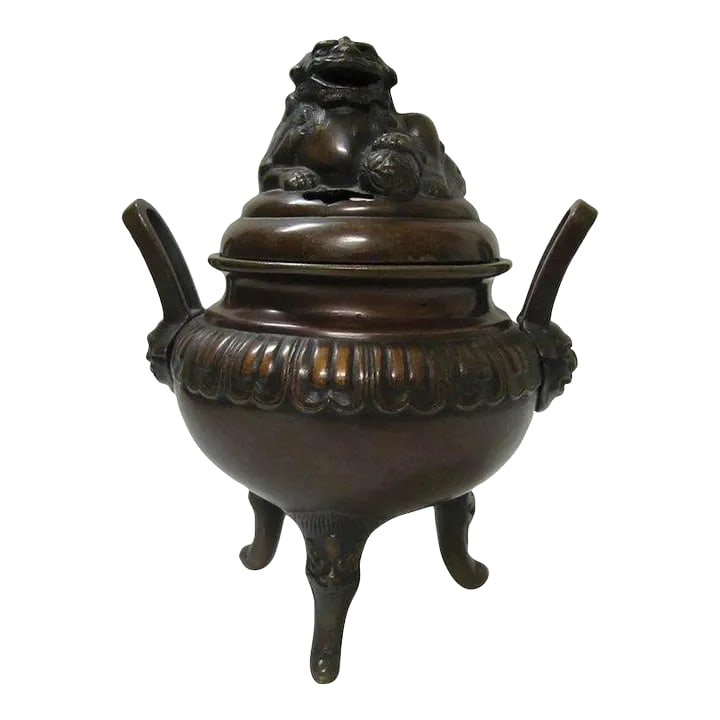 1910s Chinese Bronze Incense Foo Dog Burner: Chinese bronze fu dog incense burner with two decorated handles. Fu dogs on handles, top, and legs. Height: 8" Wide: 6" Condition: Alterations: Unknown Imperfections: Some Imperfections Condition
