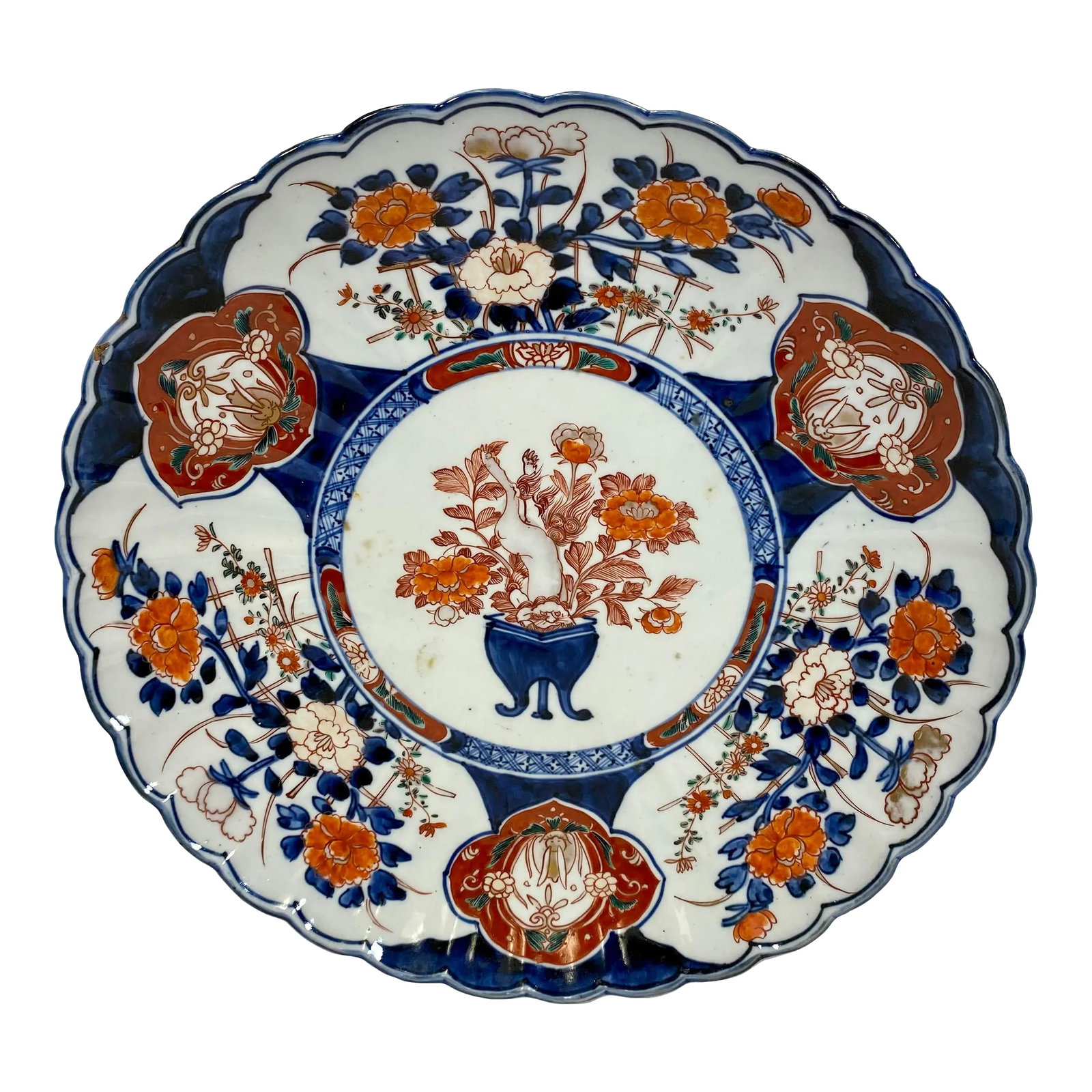 Antique Imari Plate /Charger With Scalloped Edges and Hand Painted Floral Designs - Circa 1900: Antique Imari Plate /Charger With Scalloped Edges and Hand Painted Floral Designs - Circa 1900. There is a mark on the rim that is under the glaze that looks like a piece slipped down before firing (