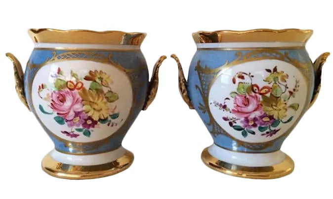 French Porcelain Cachepots - A Pair: Pair of French cachepots. Signed "Made in France." Condition: Alterations: Original Condition Unaltered Imperfections: Some Imperfections Condition Notes: Good - Moderate wear and tear, but still has 