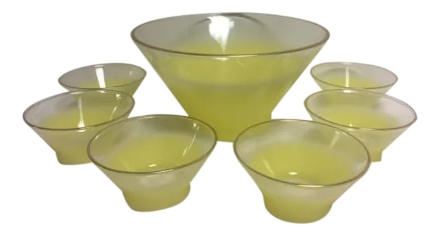 Retro Lemon Yellow Salad or Fruit Bowl With Bowls - S/7: Retro lemon yellow glass salad or fruit bowl with gold trim and 6 smaller individual serving bowls. Pristine condition, no evidence of ever being used. Larger bowl measures 10 3/4" in diameter and 6"