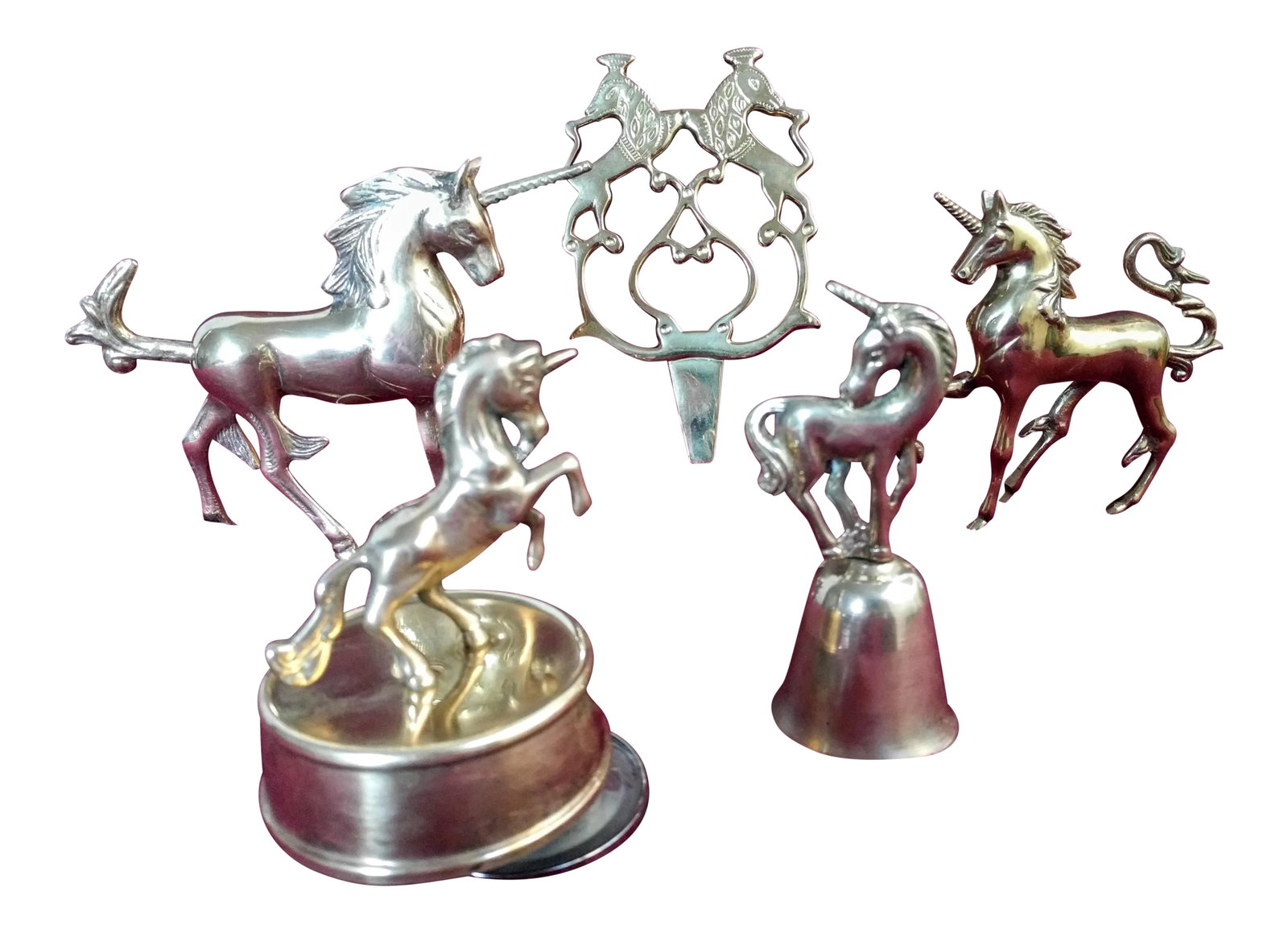 Vintage Brass Unicorn Figurines - Set of 4: These pieces are stunning in person & add a whimsical touch to your bookshelf or tabletop with this beauty. This is a set of 4 vintage brass unicorn figurines, in excellent condition for its age. Thes