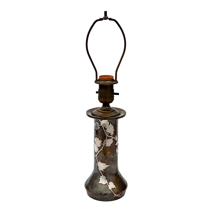 Early 20th Century Bronze & Silver Table Lamp: Early 20th C vessel in bronze with vines & leaves overlay in sterling silver overlay by renowned Arts & Crafts studio Heintz Metalworks. Newly rewired for standard bulb. Condition: Alterations: Restor