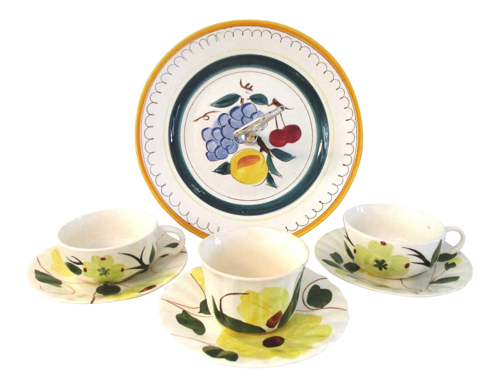 Vintage Stangl Pottery Serving Set- 7 Pieces: Lovely vintage pottery serving set consists of two yellow floral cups, (4.5"L x 3.75"W x 2"H), sugar bowl, (3.5"Dia x 2.25"H), three saucers, (3"Dia x .5"H), and Stangl Pottery handled tidbit dish (10