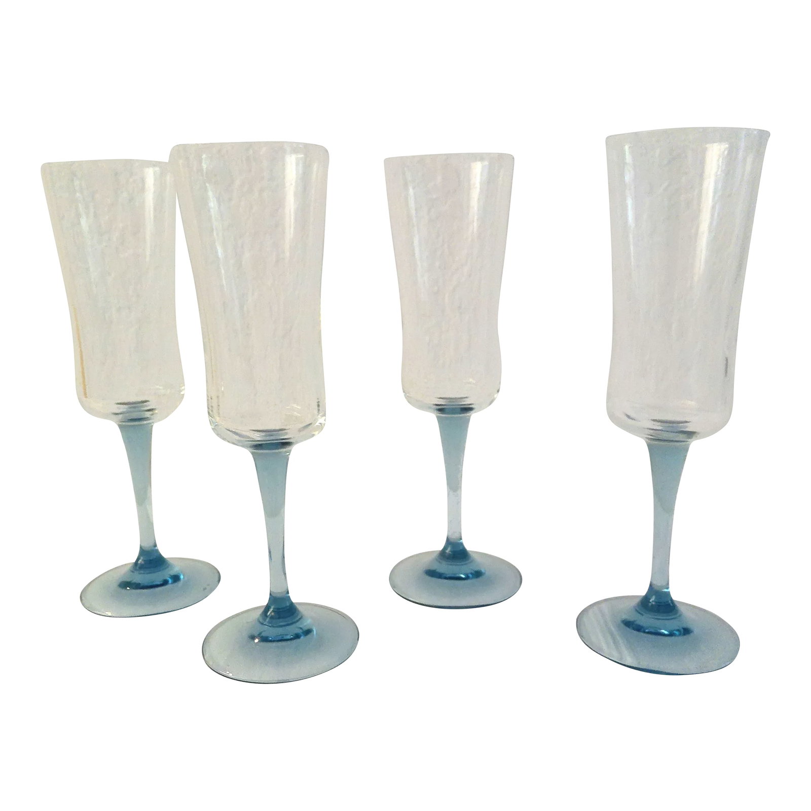 1980s French Powder Blue Stemmed Crystal Champagne Flutes, S/4: Pretty set of four vintage powder blue long-stemmed champagne flutes with clear bowls. Condition: Alterations: Original Condition Unaltered Imperfections: Some Imperfections Condition Notes: minor wea