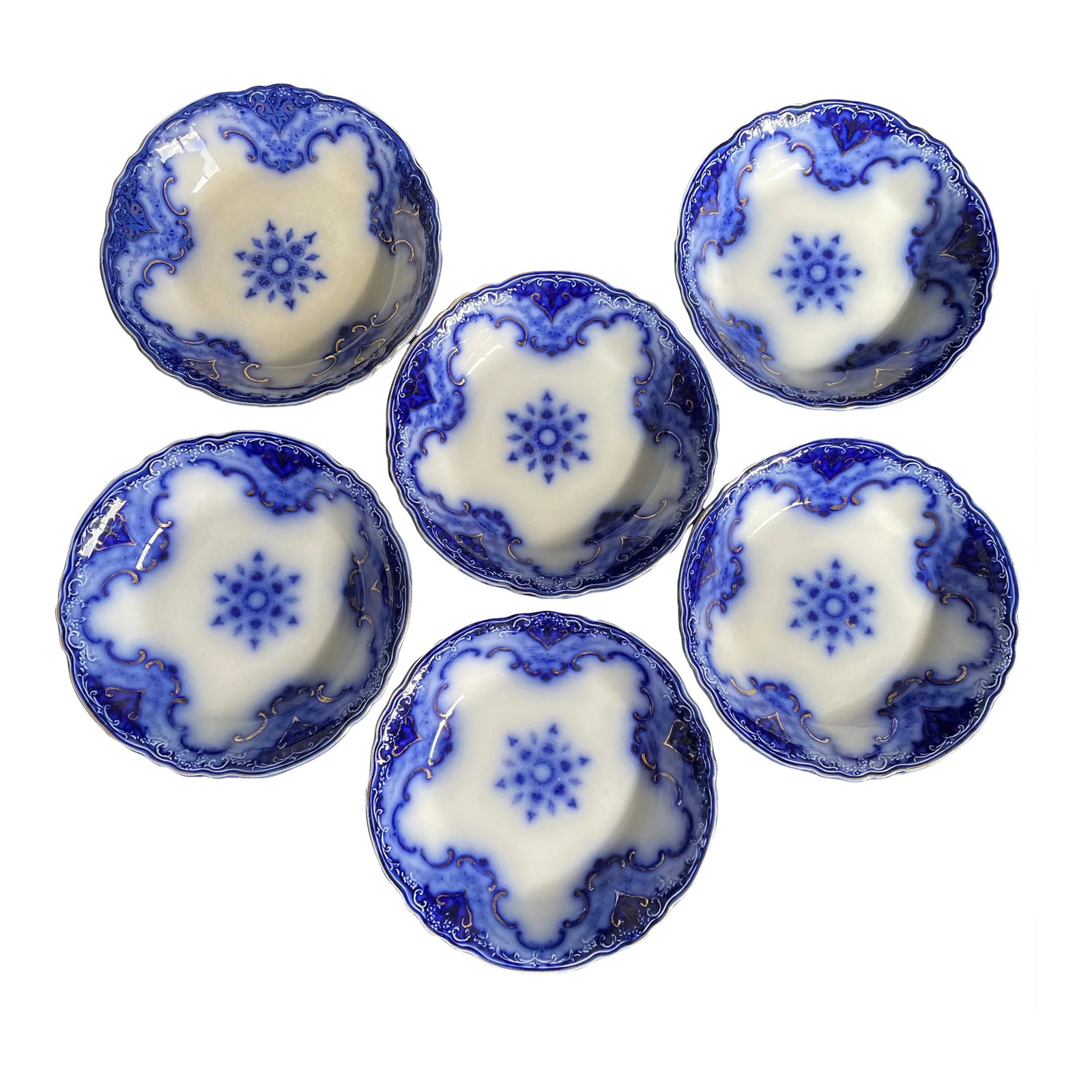 Antique Set of 6 Alfred Meakin Cambridge Flow Blue Coupe Soup Bowls With Gold Accents: Behold a captivating antique ensemble - a set of 6 Cambridge Flow Blue coupe soup bowls. These pieces carry the Alfred Meakin Ltd backstamp, which was in use from 1897 to 1930. The bowls remain in