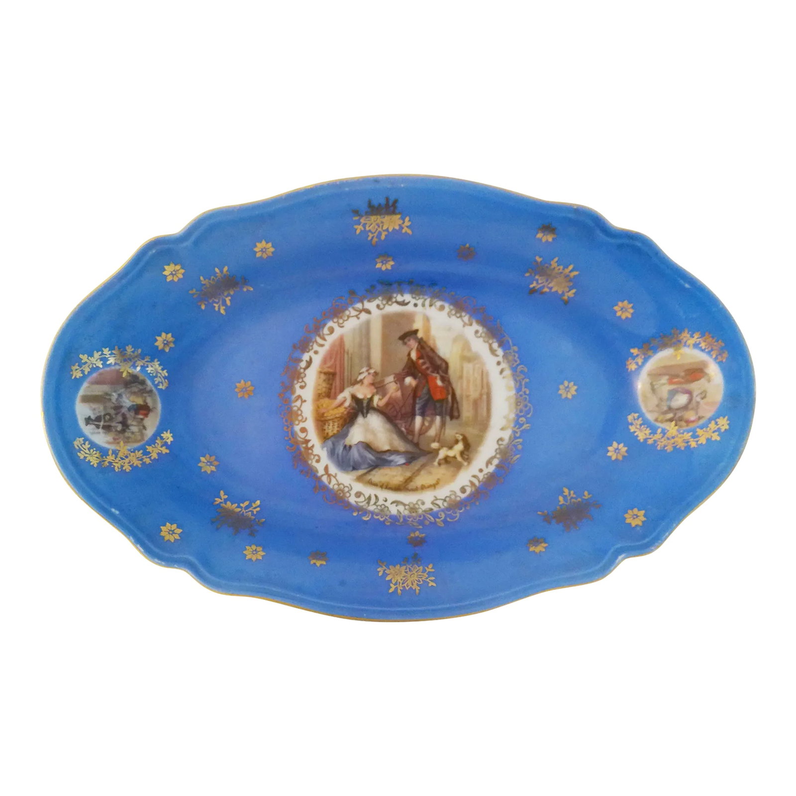 1940s Cries of London Sweet Oranges Bavarian Bowl: Pretty vintage oval shaped porcelain bowl in a striking shade of blue featuring colonial scenes with floral gold embellishments and gold rim. Marked underside "Bavaria." Lovely for use on the vanity