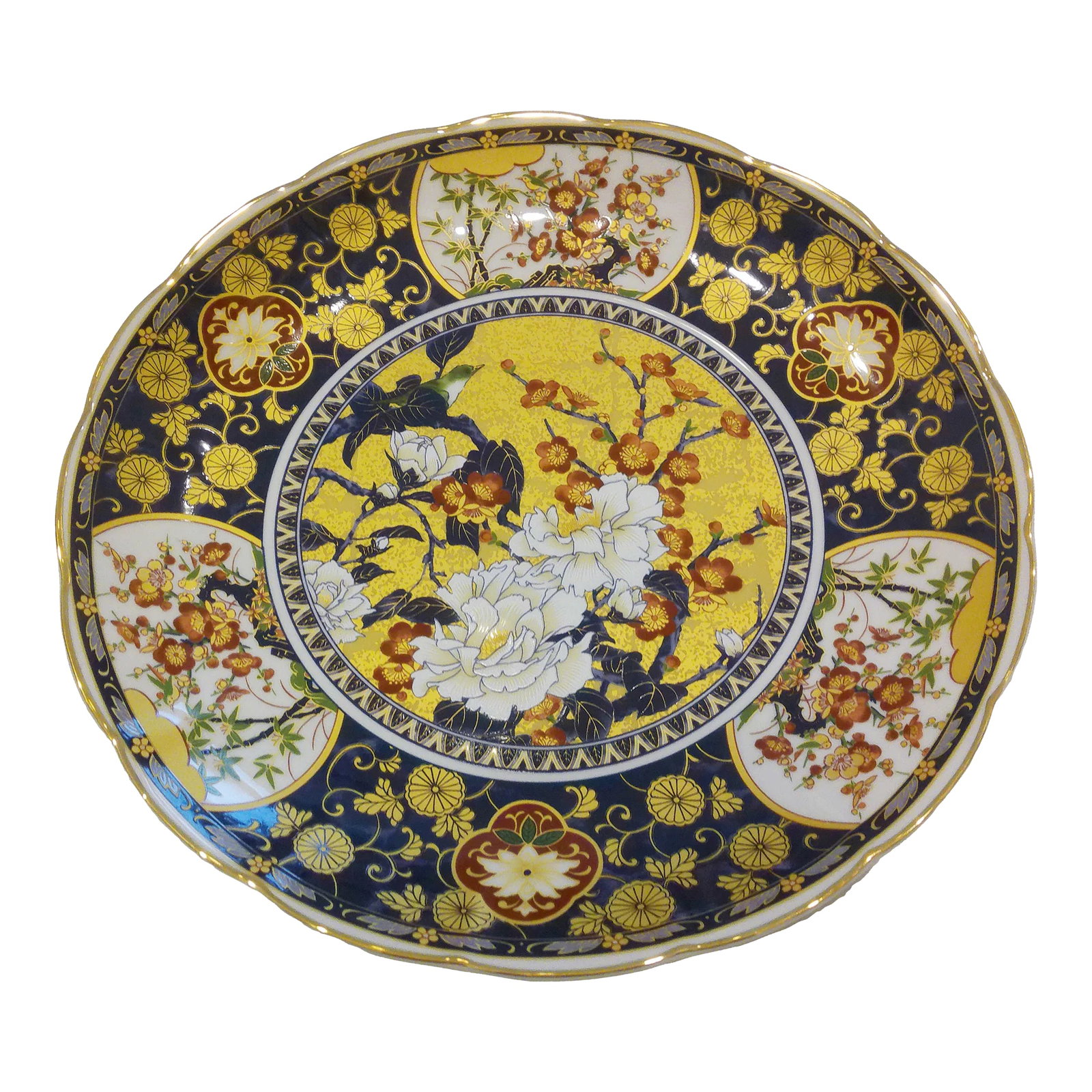 Vintage Japanese Footed Imari Design Floral Bowl: Beautiful Imari design porcelain footed shallow bowl featuring a floral design with generous gold accents throughout and scalloped gold rim. Marked underside "Made in Japan." Excellent condition.