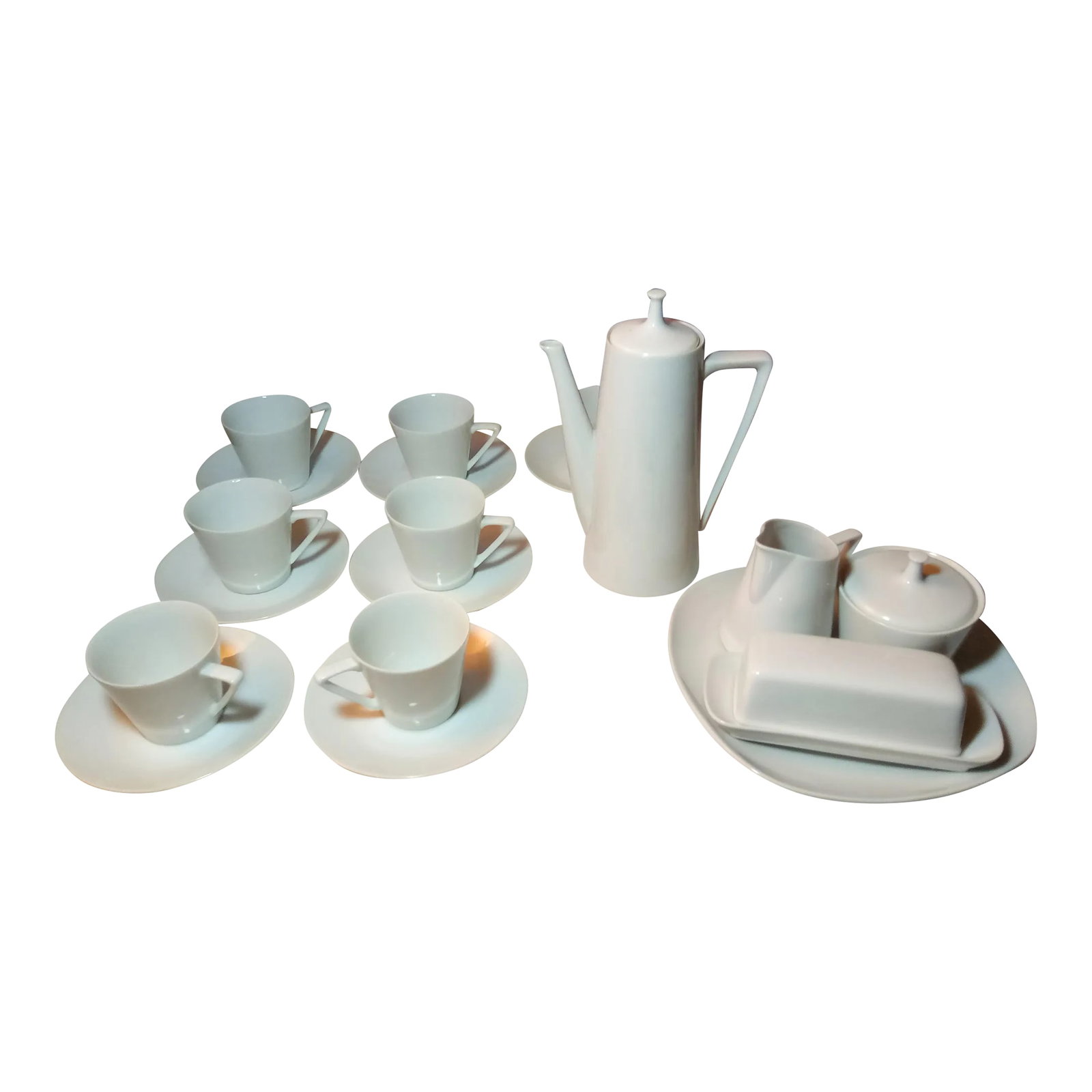 1960s White Porcelain Coffee/Tea Set- 22 Pieces: This 22 piece set looks nearly identical to Harmony House Moonglow #3900 but is missing the Harmony House logo on the bottom. I've had a German friend of mine identify this set as German Porcelain