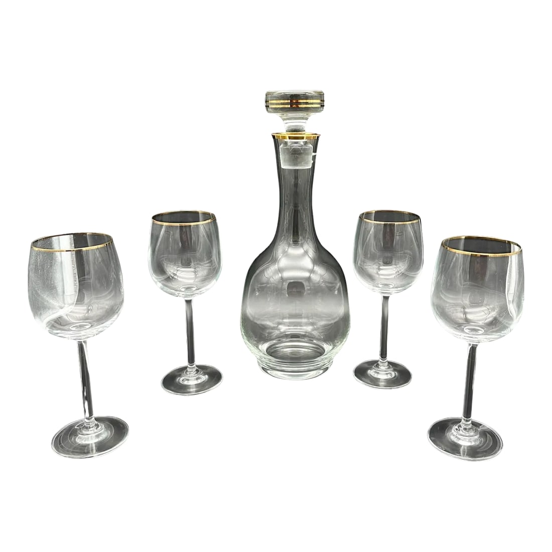 Vintage 24k Gold Rim Crystal Decanter With Goblets Set- 5 Pieces: Enhance your drinking experience with this elegant crystal decanter and goblet set. The set includes a vintage 24K gold rim decanter and 4 goblets, perfect for all occasions. The mid-century modern st