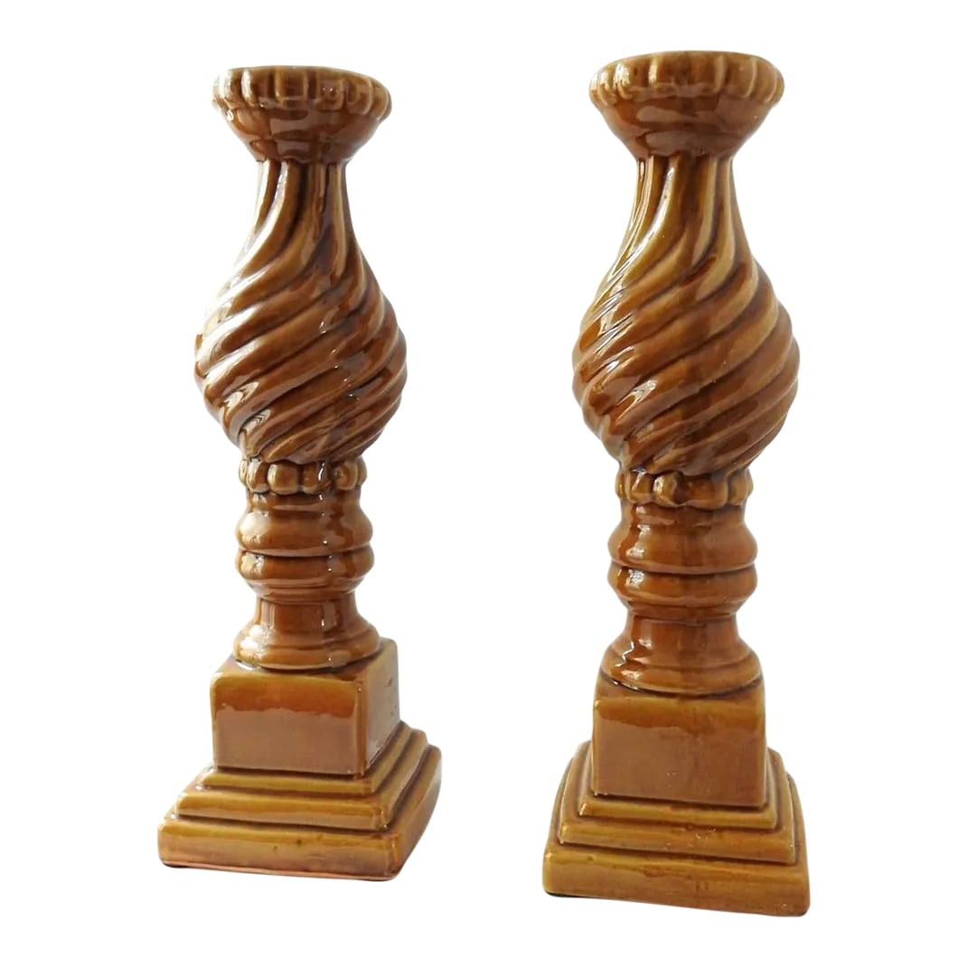 1990s Large Umber Yellow Ceramic Pillar Candle Holders- a Pair: Large ceramic umber pillar candle holders for standard tapered candles. Crackle effect, swirly pattern. Heavy. Base 6"X6". Top is 4.5" in diameter. 18.5" high. Circa 1990s. Unknown manufacturer.