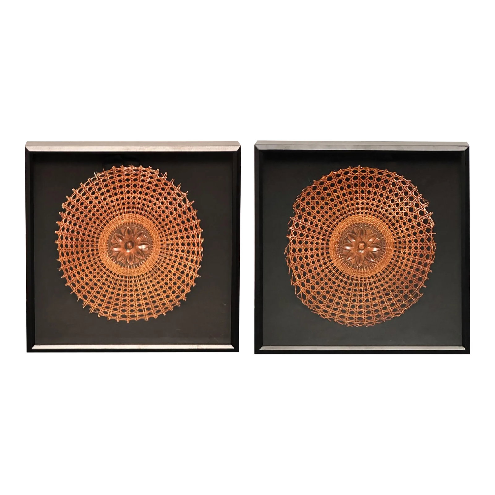 Pair of 1940s Hand Carved Wooden Flowers Surrounded by Wicker, Mounted in Black Shadow Boxes: Exquisite hand-carved flowers, meticulously crafted and salvaged from the pair of Louis XVI style chairs, delicately bloom within intricately woven wicker.. Suspended within sleek black shadow boxes,