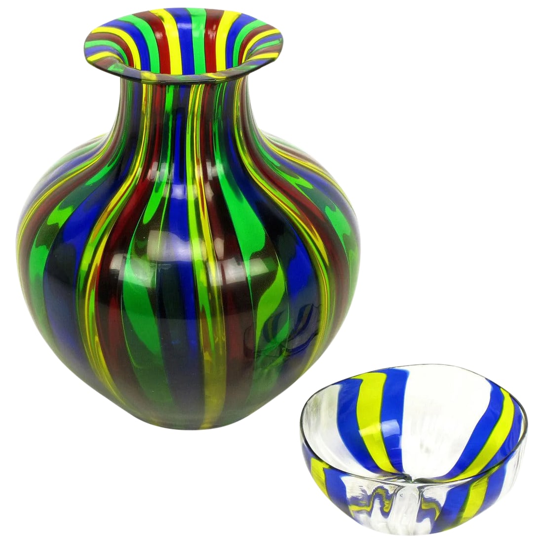 Italian Handblown Art Glass Vase With Bowl by Oggetti: Handblown art glass vase measuring 9" tall X 8" diameter in yellow, blue, green and red glass. Handblown art glass bowl measuring 5"Diameter x 2" tall. Both from Italian art glass manufacturers Oggett