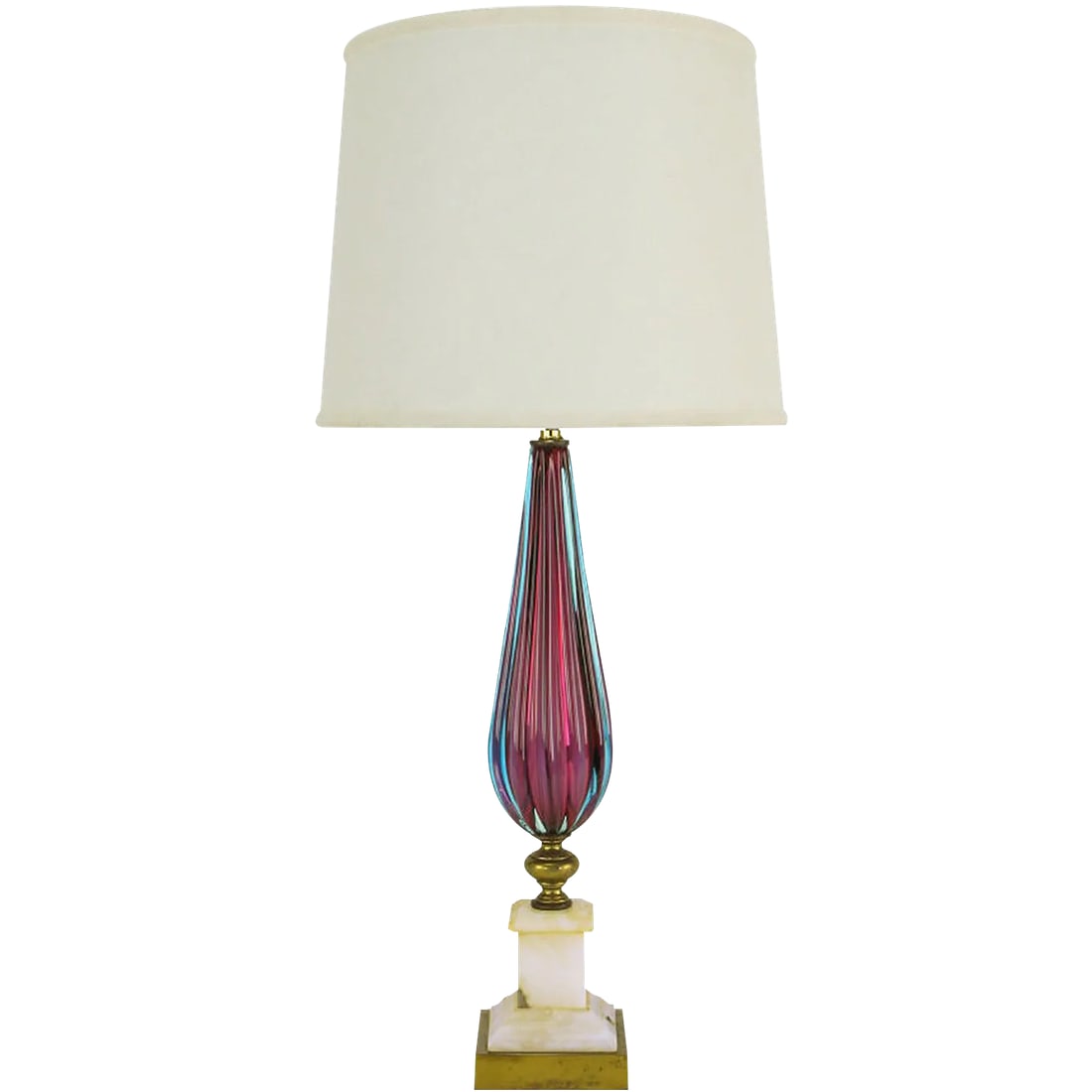 Reeded Amethyst & Aquamarine Murano Glass Table Lamp With Carrera Marble Base: Elegant hand blown reeded Murano glass bodied table lamp in amethyst and aquamarine. Base is carved and stacked Carrera marble with brass plinth beneath. Newly rewired. Double socket cluster and