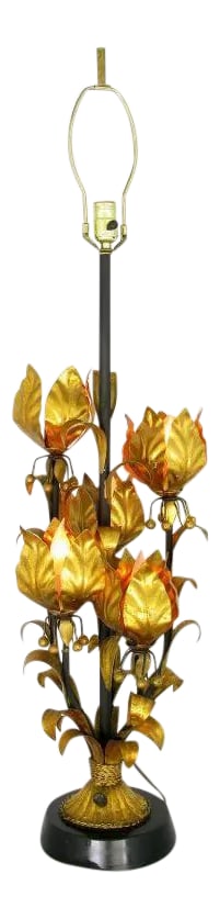 Large Gilt Metal Table Lamp with Foliate Detail: Large and striking gilt metal table lamp with illuminated foliate details. Four lotus flowers each contain a socket for candelabra base light bulbs. The metal base is finished in black lacquer. Sold s