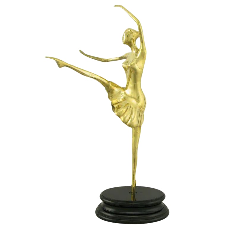 22" Brass Ballerina en Pointe Atop Black Lacquered Base: Brass sculpture of a ballerina in motion, on a black lacquered turned wood base. Condition: Alterations: Original Condition Unaltered Imperfections: Some Imperfections Condition Notes: Very good