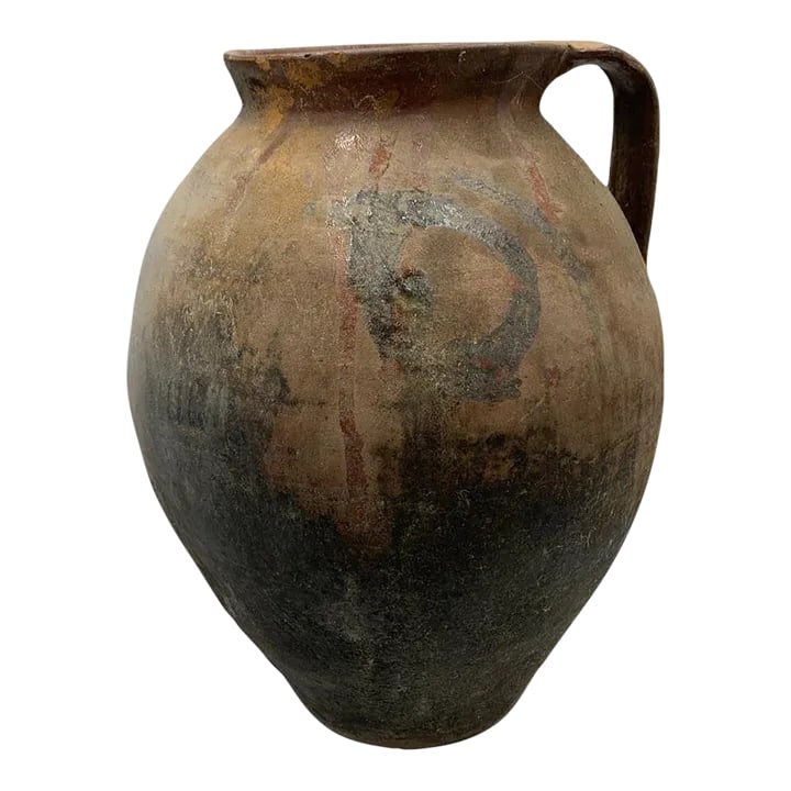 Antique Hungarian Folk Art Cooking Pottery: This antique one-handle terra cotta vessel from Hungary is a wonderful addition to any Farmhouse decor. The rustic pottery showcases a subtle hand-painted Hungarian Folk Art design peaking through
