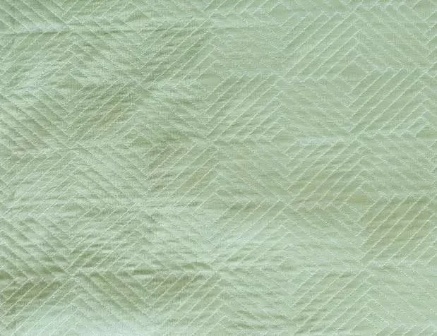 Green Geometric Diamond Fabric- 9 Yards: 9 yards of green poly-silk fabric, beautifully detailed with a subtle diamond and geometric pattern. This fabric enriches any project by adding a sophisticated layer of texture and detail to otherwise