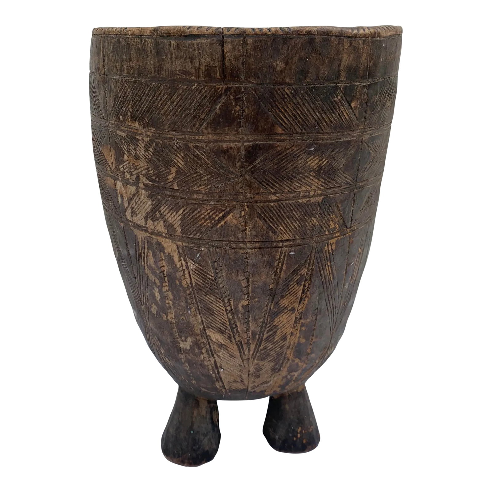 Early 20th Century Wood Vessel: Antique hand carved 4-legged tribal wood vessel. Intricate linear pattern design with handle for rope or hook. Inside hollowed out with a smooth finish. Condition: Alterations: Original Condition
