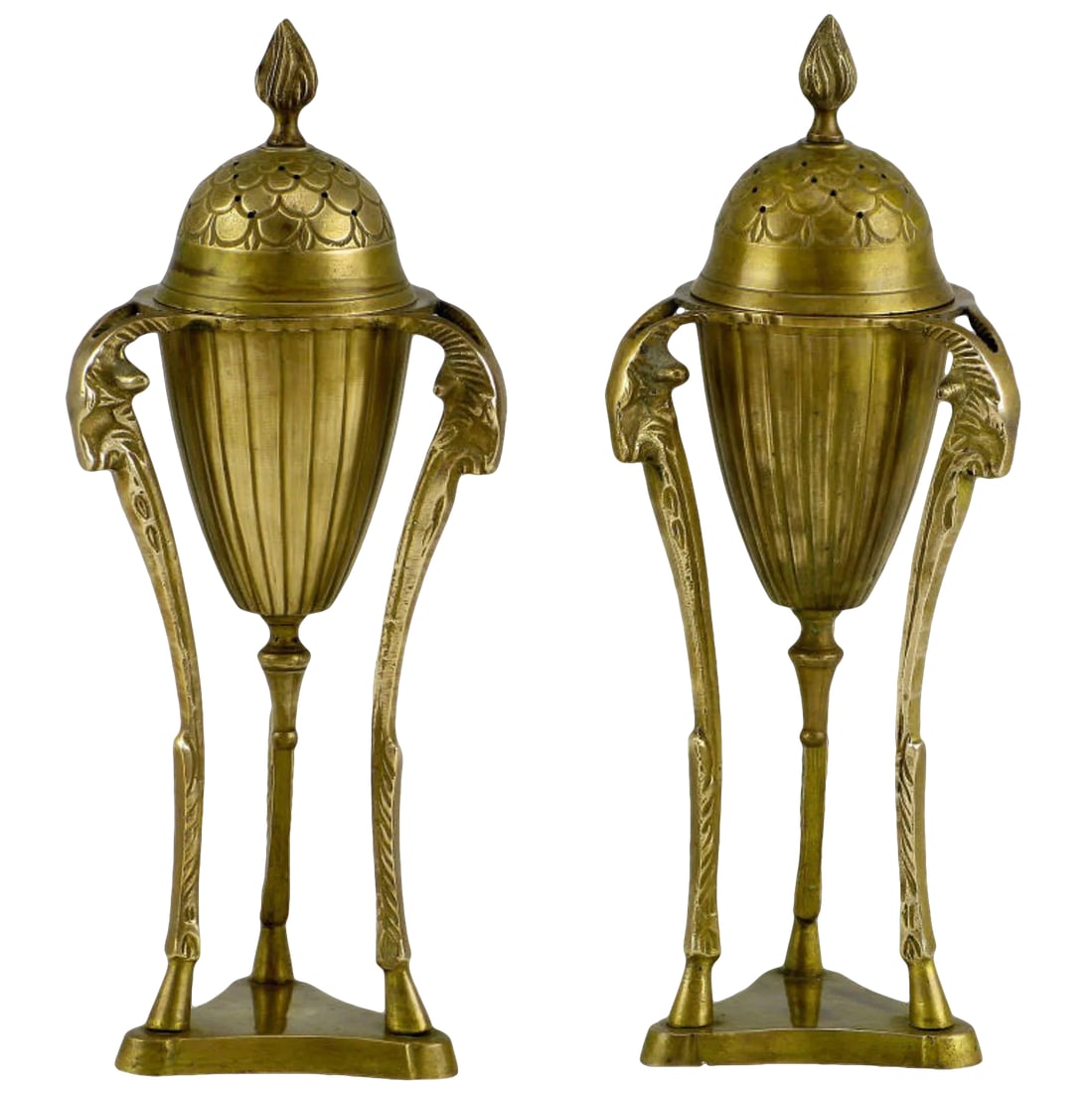 Brass Rams Heads & Hooves Empire Style Censers - a Pair: Beautifully patinated Empire styled brass urns adorned with three rams heads and hooved pilaster legs surmounted on trefoil brass bases. The pierced cap has a flame finial top and is removable. The co