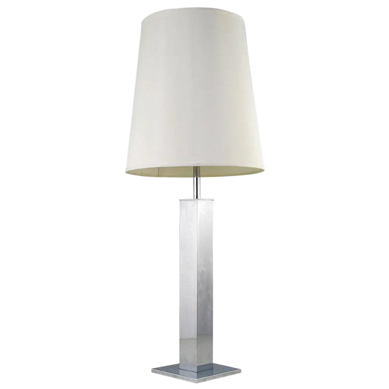 Large Chromed Column Table Lamp by Nessen: Elegant and clean lined chrome table lamp from American lighting pioneer Walter Von Nessen. Original milk glass diffuser. Sold sans shade. Condition: Alterations: Original Condition Unaltered