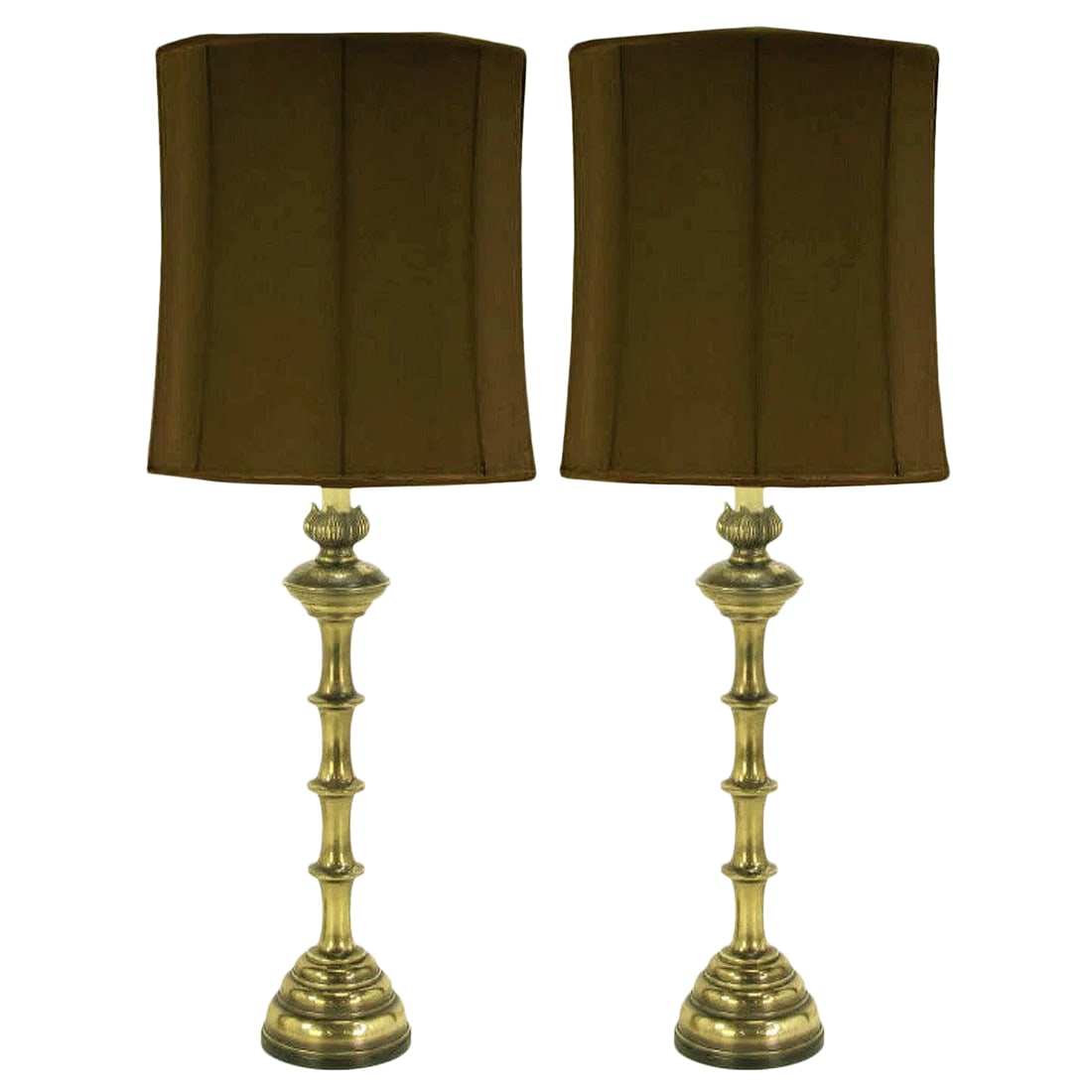 Stiffel Patinated Brass Table Lamps - a Pair: Pair of patinated solid brass baluster form 52" table lamps. Traditional Machine Age bases with flared section bodies that finish with a poppy flower bobeche. Lacquered ivory metal stems with brass