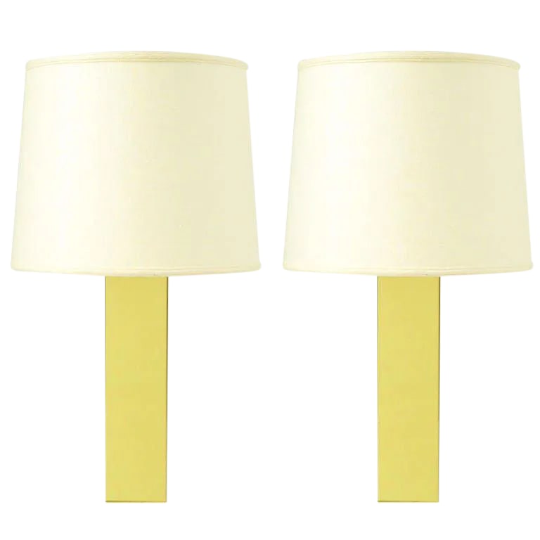 Pair Polished Brass Column Table Lamps: Pair of polished brass column bodied table lamps with brass stems and brass socket. Condition: Alterations: Original Condition Unaltered Imperfections: Some Imperfections Condition Notes: Very good
