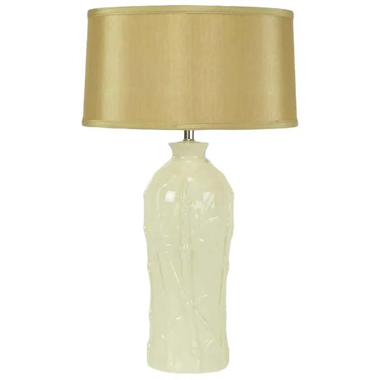 Glazed White Bamboo Relief Ceramic Table Lamp: white glazed ceramic table lamp in bottle form with bamboo stalk and foliate relief. Sold sans shade. Condition: Alterations: Original Condition Unaltered Imperfections: Some Imperfections Condition