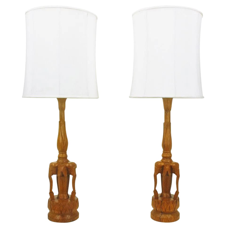 Tall Hand-Carved Hardwood "Trio of Elephants" Table Lamps - a Pair: Pair of expertly carved, one of a kind, trio of elephants table lamps. Carved from two pieces of hardwood, the single piece base and the baluster style stem. Newly fitted and rewired with brass double