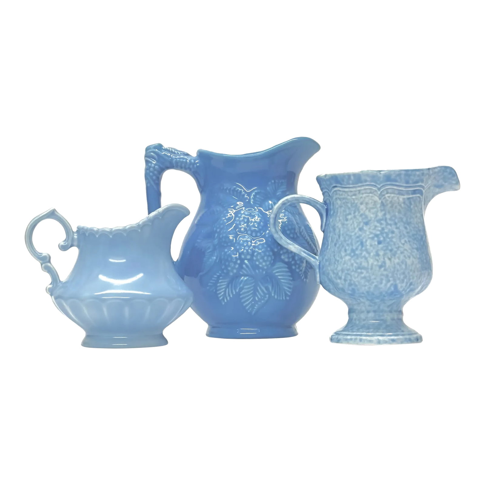 Mid 20th Century Textured Sky Blue Ceramic Pitcher Curation - Group of 3: Sky blue textured pitchers, group of 3. Gorgeous set of assorted light blue ceramic pitchers from the mid-20th century. Featuring a piece by Mikasa. Shortest: 4"H Tallest: 6"H Condition: Alterations: