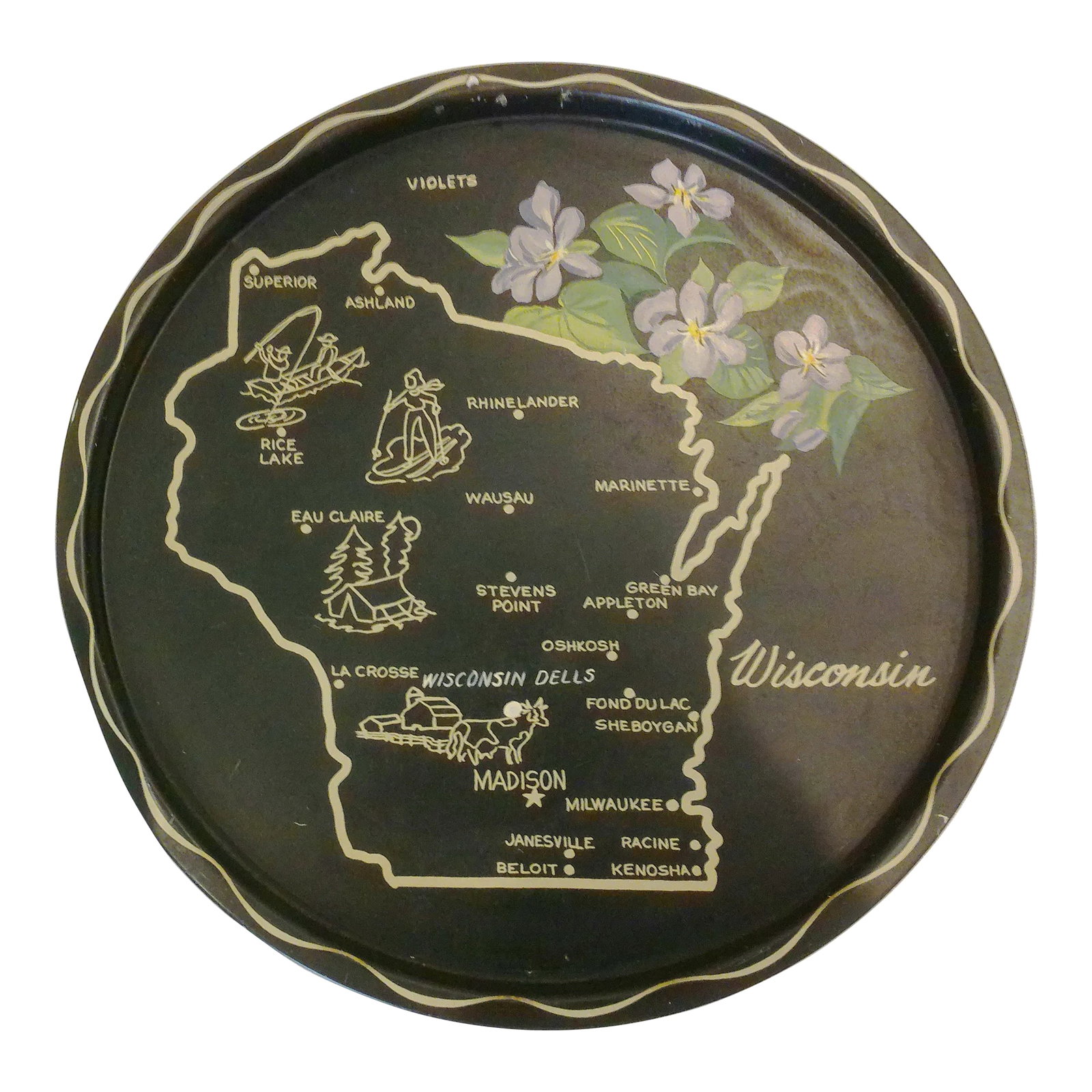 Mid-Century Wisconsin Metal Tourist Tray: Nostalgic mid-century black metal tray featuring a map of Wisconsin in tan and depicting the state flower - Violets, in shades of lavender, white and green. Condition: Alterations: Original Condition 