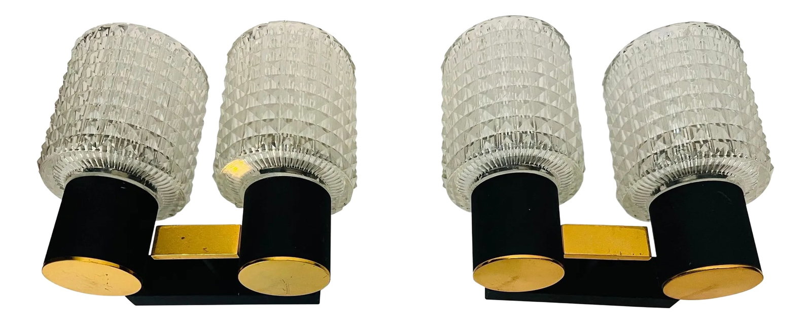 Pair French Lunel 1960s Mid-Century Wall Lights: An original pair of French 1960s sconces composed of golden polished brass and black enamel fixtures with cut crystal glass shades. Made by the lighting company Lunel. Rewired with two candelabra