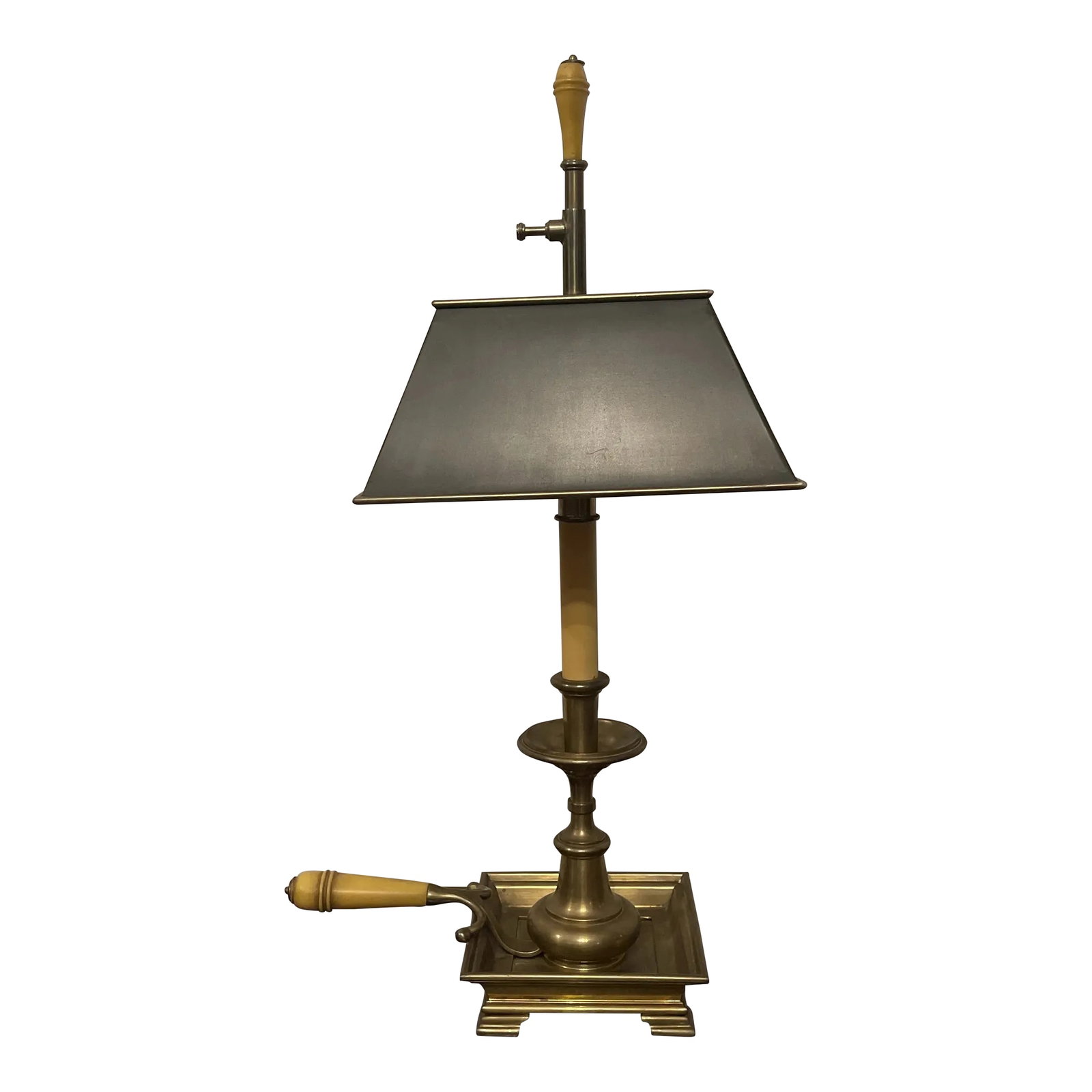 1980s Chapman Brass Candlestick Lamp With Black Tole Shade: High Quality, Vintage, Chapman Lamp in the form of a brass Chamberstick candle holder with a square drip pan on ogee bracket feet, having a Bakelite handle. The square black tile shade is polished bra