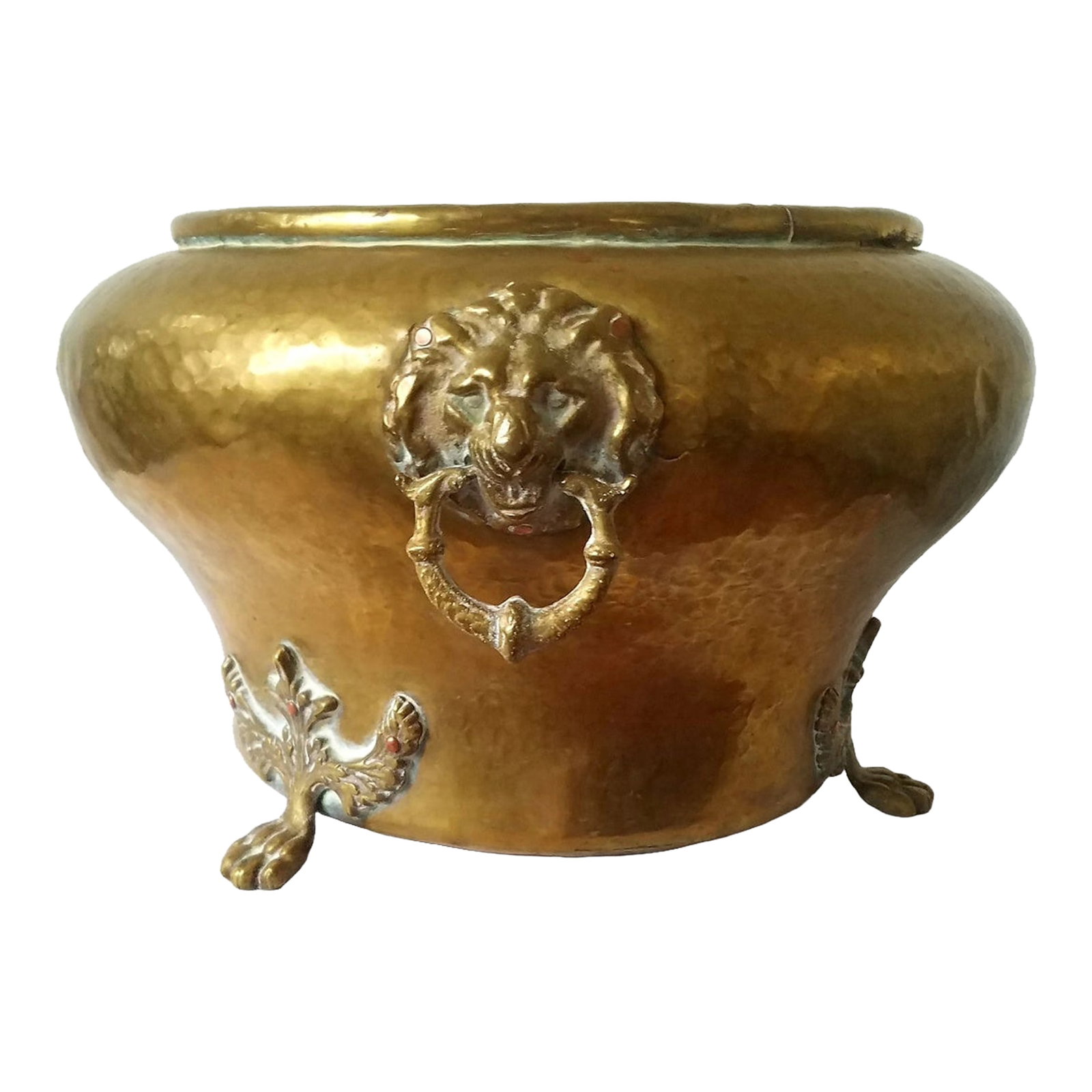 Late 19th Century Hand Hammered Brass Cachepot With Lion Head Paw Foot: This is an Imperial Russian late 19th-century hand-hammered brass cachepot, planter, jardiniere, or a decorative over pot. Two lion head mounts, one with a ring and one without. The pot is resting on 