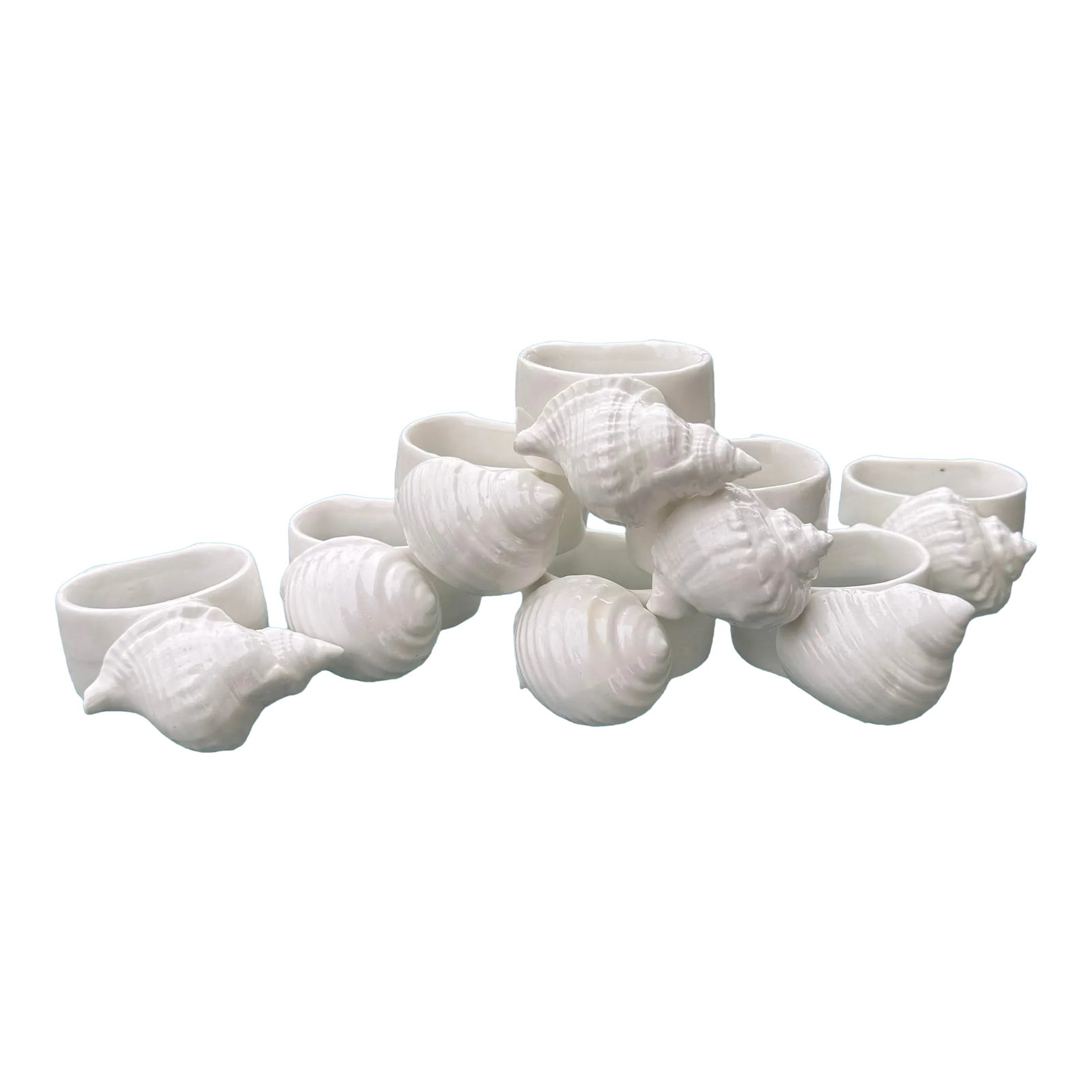 Porcelain Sea Shell Napkin Rings- Set of 8: Set of 8 seashell napkin rings in excellent condition. Condition: Alterations: Original Condition Unaltered Imperfections: Some Imperfections Condition Notes: Small black specs underneath the glaze in