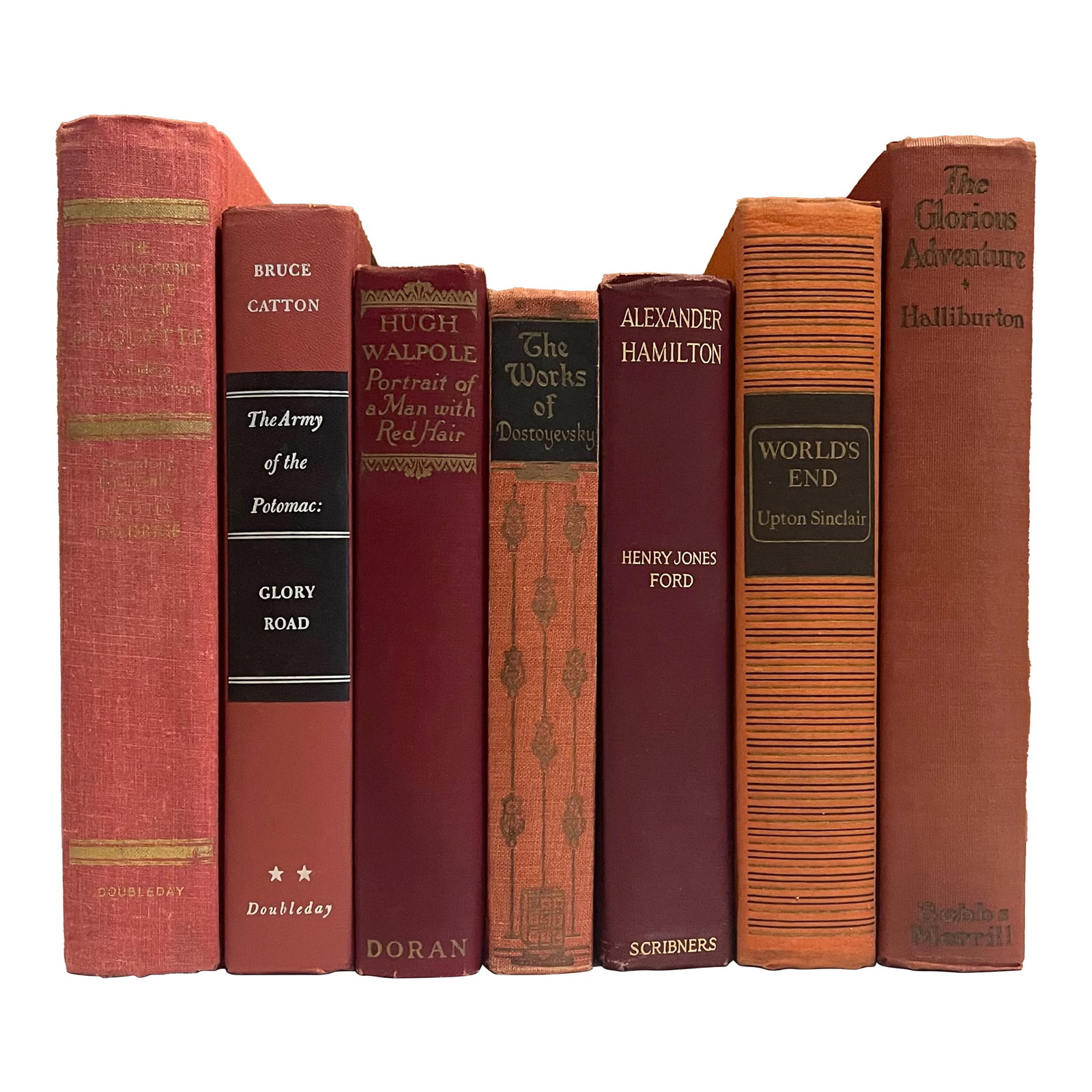 Vintage Red Decorative Book Set- 7 Pieces: A group of cloth bound dating from the early to mid 20th century on a variety of subjects in shades of red. The collection measures 10 1/2 inches wide when displayed together. Individual volume