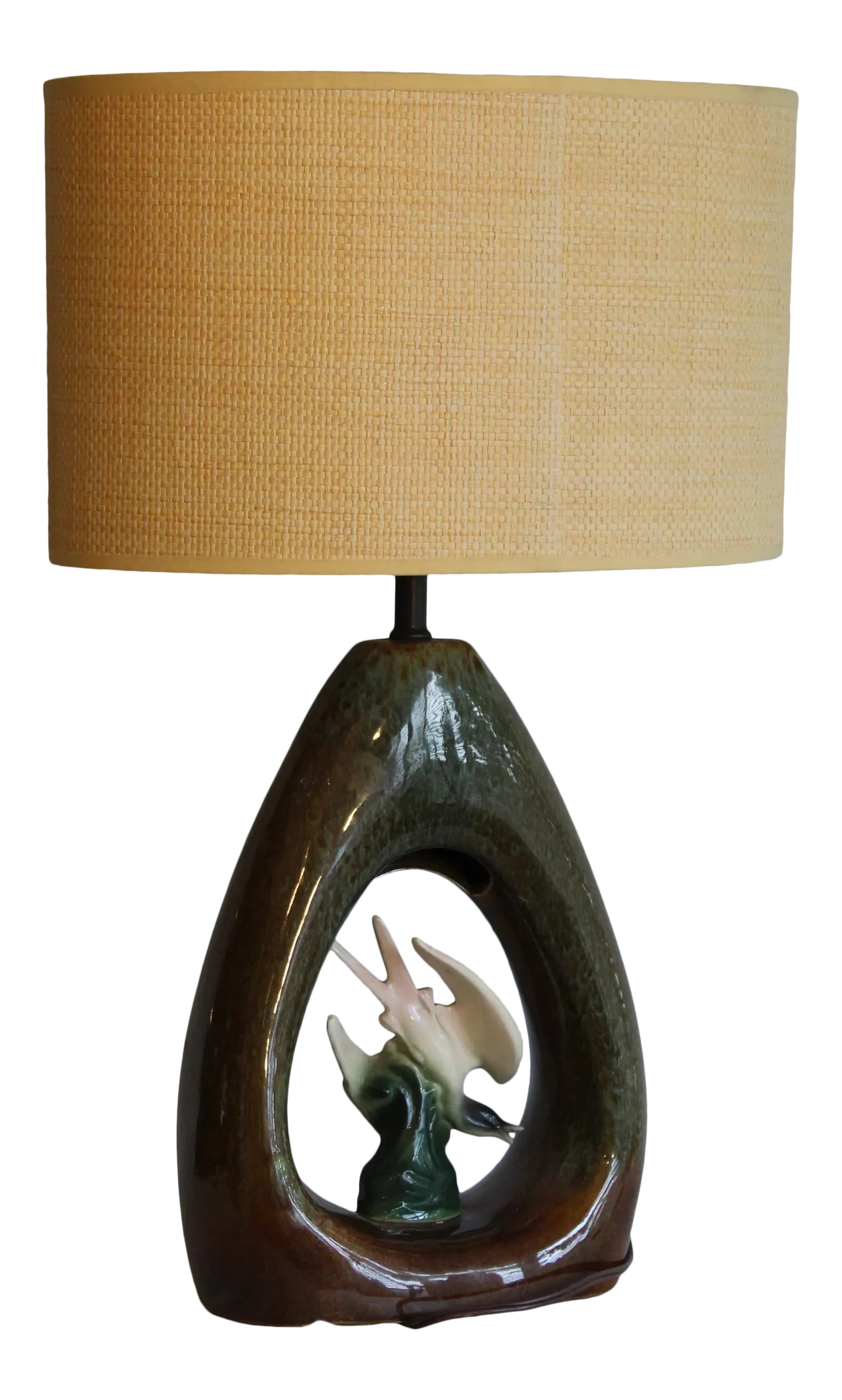 Fifties California Sculptural Table Lamp.: Beautiful California ceramic lamp. Gracious shape. Sculptural birds in flight. Blended hand glaze which gives each piece a unique look. A oval woven rattan shade to complement the piece. Dimensions ar