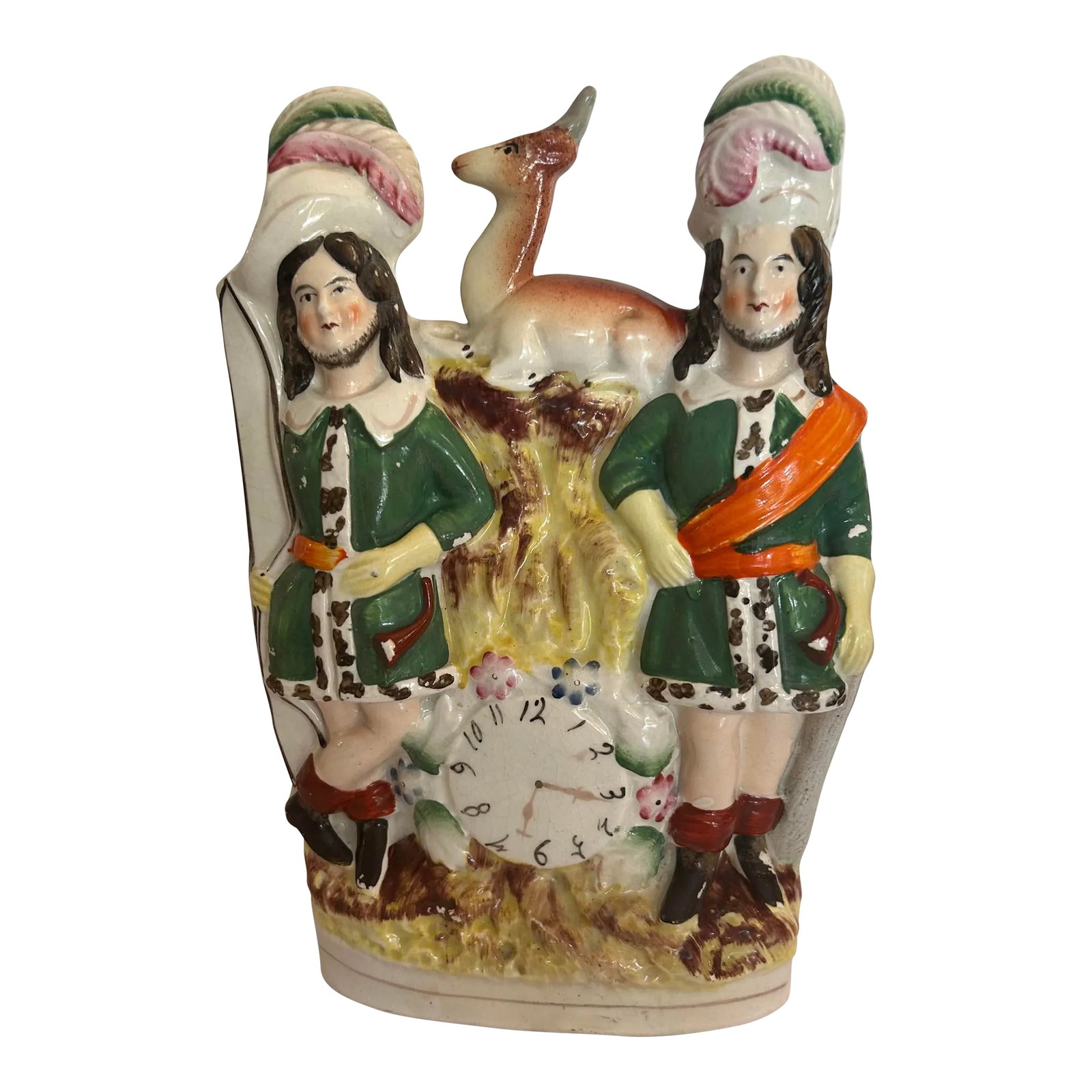 Antique Staffordshire Figurine Depicting 2 Hunters With Plumed Hats, a Bow, a Deer on Top and a Cloc: Antique Staffordshire Figurine depicting 2 Hunters with Plumed Hats, a Bow, a Deer and a Clock at the bottom. Circa 1850 Very good condition. No repairs Some paint missing from both green jackets.