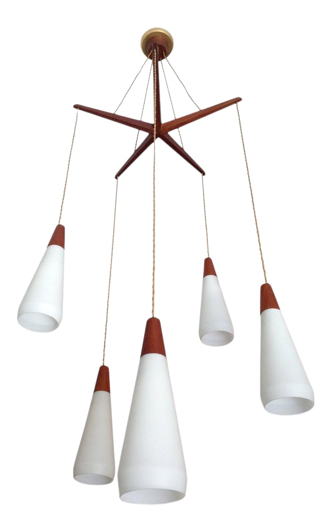 Dutch 1950s Hanging Pendant: A wonderful "Mid-Century" 1950s Dutch chandelier composed of a teak stretcher, rayon cords, milk glass shades, and teak caps. Rewired. The height can be adjusted if needed. Condition: Alterations: Res