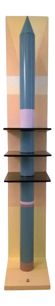 1980s Sculptural Rocket Shaped Floor Lamp: A sculptural rocket shaped floor lamp done in a purple and blue lacquered metal rocket with three smoked glass trays, a beige, pink and yellow lacquered wood base. Three shelves. Long hallogen tube. C