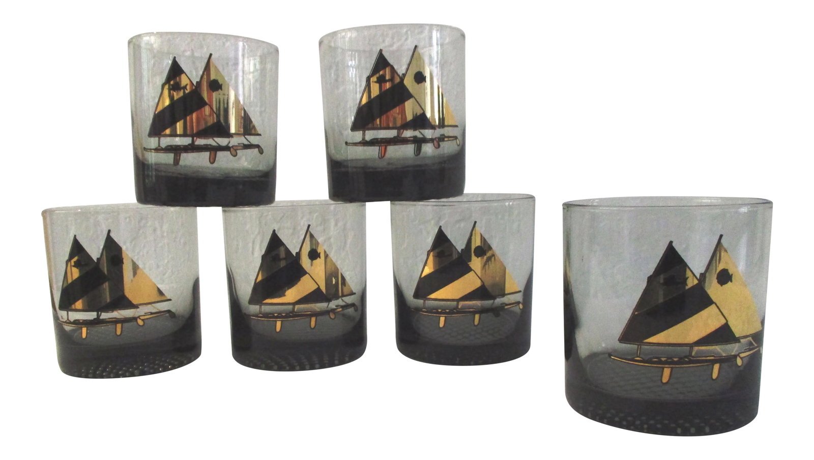 1970s Smoke Catamaran Lowball Glasses - Set of 6: Stylish set of 6 1970s smoke lowball glasses featuring a black and gold catamaran on face with thick glass bases. Excellent condition. Condition: Alterations: Original Condition Unaltered