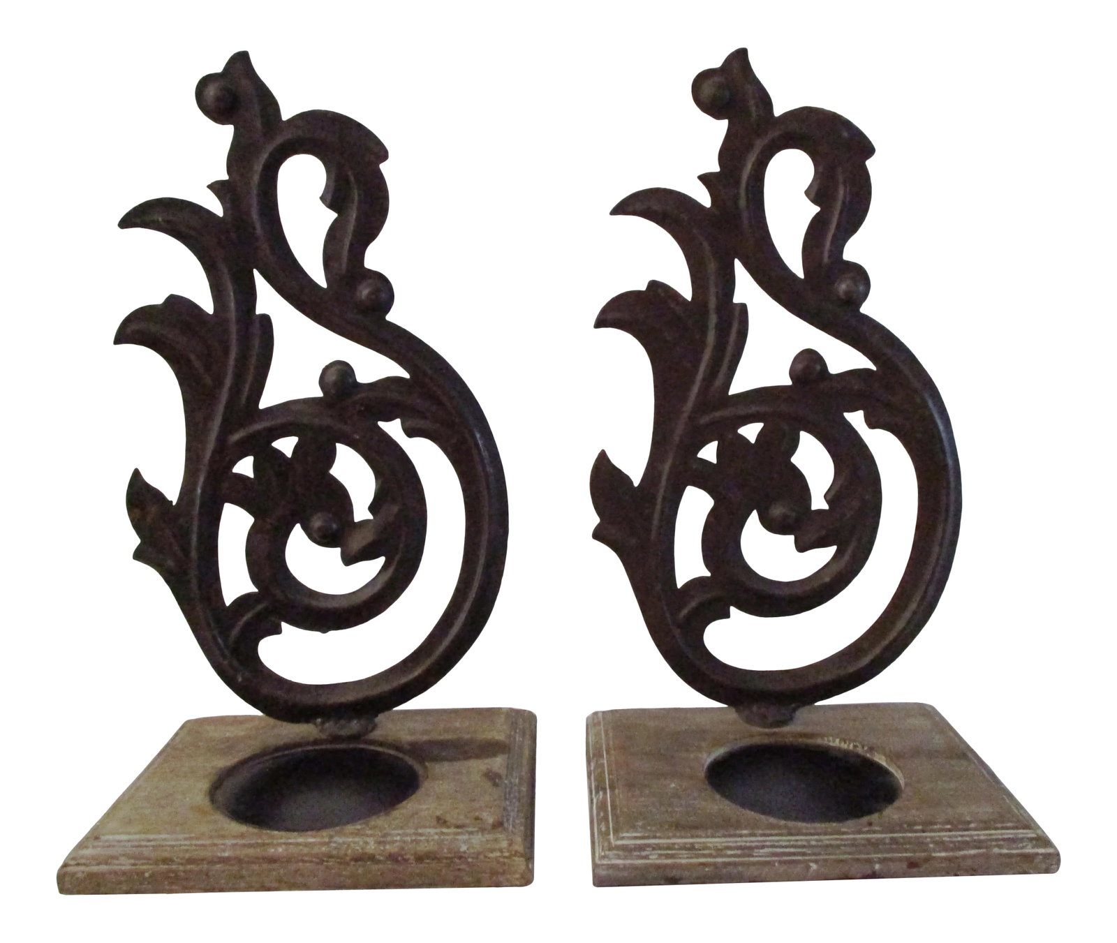 Rustic Wood & Metal Candle Holders: Stylish pair of distressed wood and metal candle holders. Ornate metal design mounted on distressed wood bases. Each holds one pillar candle. Use on flat service or wall mount using a nail or hook